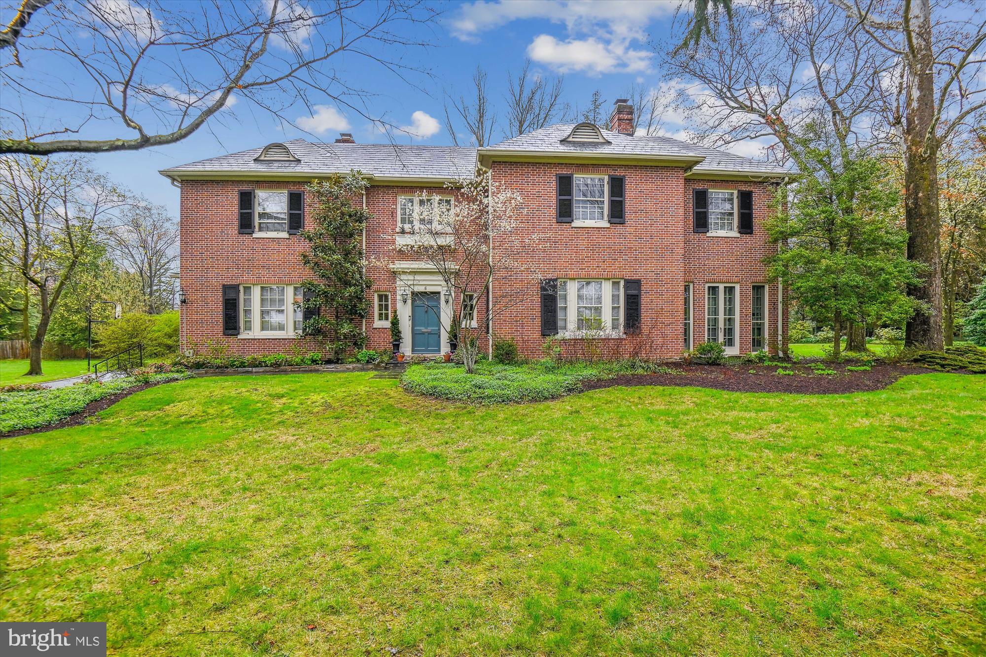 Welcome to 6 Gittings Avenue - a stately, brick, Georgian residence, constructed for the ages in 1928, that truly blends timeless sophistication and modern amenities.  As you step through the gracious foyer, you're flanked by the elegance of a magnificent living room with ample natural and recessed lighting and gas fireplace, and a large formal dining room.  Together, they offer perfect, flowing space for hosting gatherings and entertaining guests. The glorious sunroom/den beyond the living room beckons with abundant natural light, offering a tranquil space to relax and unwind.

The updated kitchen boasts modern amenities for culinary endeavors, enhanced by a well-designed, gracious butlers pantry.  The adjacent breakfast room beckons family and friends to share and make memories.  The modern, practical ‘command central’ is ideal for tracking all of life’s activities and staying organized. 

Connected to the kitchen is a family room addition with gas stove centerpiece, providing a cozy atmosphere for casual family time and cherished moments.

Convenience meets functionality with a home gym, mudroom with family member cubbies, and attached 2-car garage, ensuring seamless transitions between indoor and outdoor activities.

Ascend the front or back staircases to discover four bedrooms boasting soaring ceiling heights, creating an atmosphere of spaciousness and grandeur. Each bedroom offers ample closet space, providing storage solutions to meet your needs. Also enjoy the convenience and practicality of a 2nd floor laundry room. The third floor offers a tucked away 5th bedroom or home office, and even more storage.

Hardwood floors throughout lend a touch of sophistication and warmth to the living spaces, enhancing the home's timeless appeal. With 3.5 updated bathrooms, including modern fixtures and finishes, convenience and comfort are seamlessly integrated into every corner of this residence.

An exceptionally large, flat and private 1+ acre yard and exquisite, ballroom-sized stone patio with brick retaining wall offer opportunities for outdoor enjoyment and recreation.  You can (and it has been done!) field a full team lacrosse practice. It is rare to find such a magnificent setting in the City.

Arrive home and park in your garage via a private driveway that offers off-street parking for up to 10 cars.  

With its blend of classic charm and modern comforts, this home embodies lasting refinement and is poised to become your beautiful sanctuary and perfectly practical home in Baltimore.