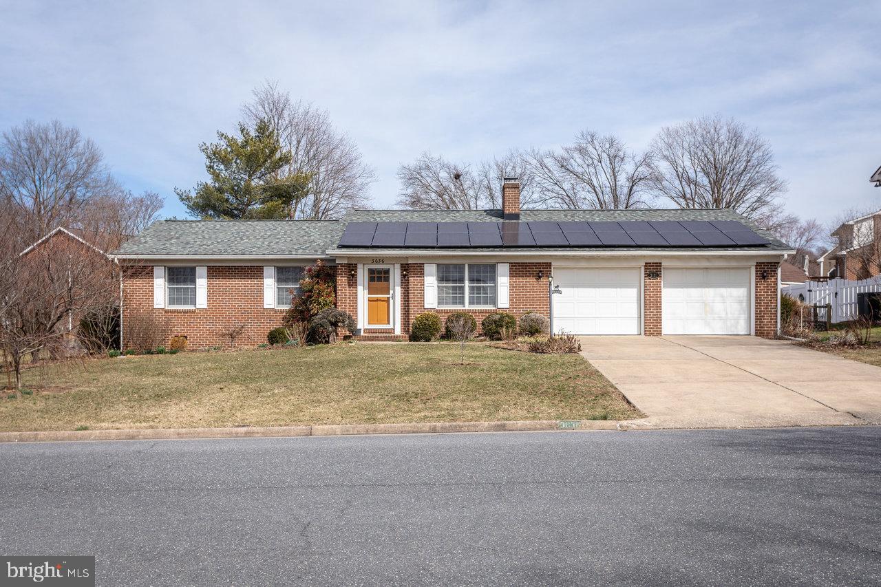 Brick rancher in Belmont with everything on one level! 27x17 great room with vaulted ceiling, 11x17 kitchen with bar seating, 12x16 enclosed porch with two skylights, laundry room with utility sink. Three bedrooms and two full bathrooms (both with tile flooring), including owner's suite. Hardwood flooring in great room, kitchen, and hallway. Spacious double garage with built-in cabinets (additional storage in shed). Back yard has fenced-in area with raised gardening beds, as well as four peach trees and a raspberry patch! Roof replaced in 2017, HVAC system in 2019. Solar panels on roof provide a significant monthly discount on electric bill!