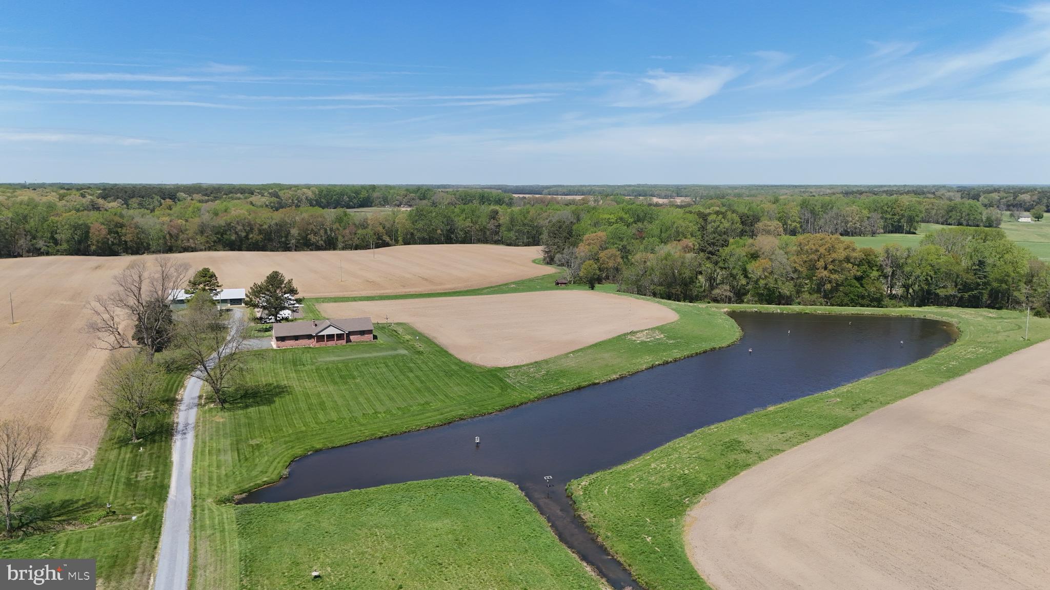Talbot County Farm With Country Home, Multiple Outbuildings And Tillable Ac
This exceptional farm in Talbot County, Maryland, presents a rare opportunity to own a highly productive Eastern Shore property that combines agricultural value, quality improvements, and premier recreational appeal. Situated in a region known for its fertile soils and strong farming history, this 90 acre home farm offers a balanced mix of tillable acreage, improved structures, and wildlife habitat, making it well-suited for farming operations, outdoor recreation, and long-term land investment. The property has a proven track record of row crop production, including corn, soybeans, and wheat. A diverse and productive soil profile supports continued agricultural use, with primary soils consisting of Mattapex silt loam and Nassawango silt loam across the majority of the fields. Additional areas include Mattapex-Woodstown soils located within previously enrolled CRP sections and wooded portions of the farm. These soils are well regarded across the Eastern Shore for their consistency and productivity, providing a solid foundation for both commercial farming and conservation practices. The farm is zoned agricultural, allowing flexibility for a variety of uses, including crop production, recreational enjoyment, and potential enrollment in conservation programs. A large portion of the acreage is tillable, offering income potential or lease opportunities, while the remaining mix of timber and habitat enhances the property's recreational value. At the center of the property sits a well-maintained 1,966 square foot brick ranch-style home built in 1997. The residence offers three bedrooms and two full bathrooms and has been thoughtfully designed for both comfort and functionality. The main living area features a spacious living room with a knotty pine accent wall and bowed window that brings in natural light. The dining room includes chair rail detailing, tongue-and-groove paneling, and a built-in glass-front cabinet, creating a functional and inviting setting. The kitchen is well-appointed with wood cabinetry extending to the ceiling, crown molding, stainless steel appliances, and a center island with seating. A pass-through connects the kitchen to the dining area, improving flow for daily use and gatherings. French doors lead to a sunroom that overlooks the surrounding farmland and wooded edges, providing a consistent view of the property throughout the seasons. The primary suite includes a private bathroom with a deep jetted soaking tub. Additional features of the home include a covered front porch and an attached two-car garage. Supporting the agricultural operation are several outbuildings, including a milk house and two additional structures, highlighted by a custom-built steel building. These improvements provide space for equipment storage, workshop use, and potential game processing. From a recreational standpoint, this Talbot County farm offers strong hunting opportunities. A large pond, complete with a strategically placed hunting pit, is heavily utilized by migratory Canada geese during the season. The combination of open ground, water, and surrounding timber creates an ideal setup for waterfowl hunting. The property also supports a healthy population of whitetail deer, adding to its appeal for hunting and outdoor recreation. For buyers seeking additional acreage, an adjoining 82.54 acre tract is also available. This parcel includes a large portion of tillable ground, with sections previously enrolled in CRP. The additional tract provides an opportunity to expand the farming operation, increase recreational use, or secure additional investment acreage. It may be purchased together with the home farm or separately, offering flexibility for a range of buyers. It's l


Property taxes shall be based on the acreage as determined by the Buyer’s survey and the acreage conveyed. Taxes will be prorated proportionally from the total parent tract of 582 acres.