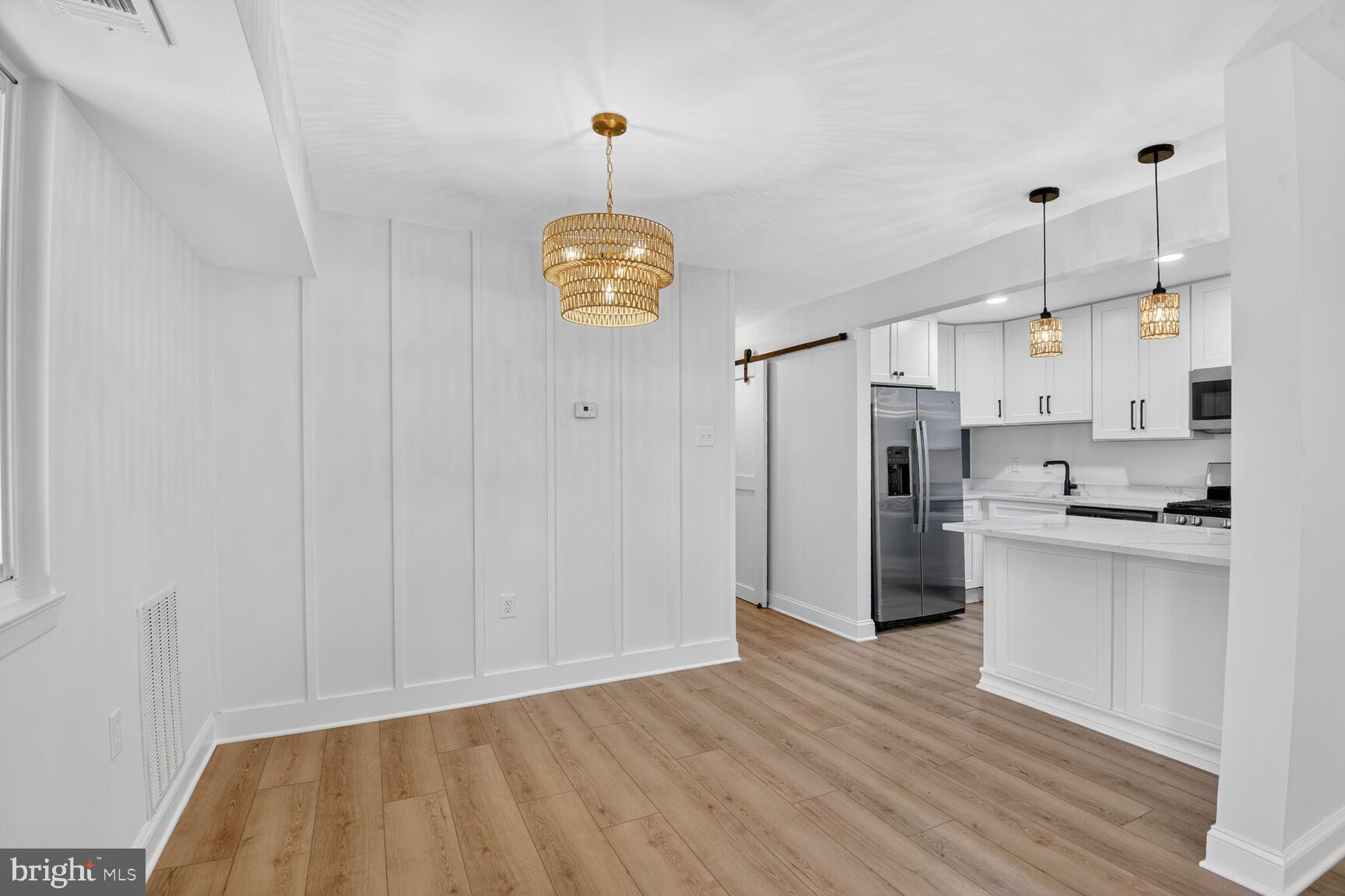 Ground Floor Living! Absolutely stunning & fully remodeled condo in Fairwinds of Annapolis.  Featuring 2 bedrooms and 2 full bathrooms, this condo shows as well as any condo you will find in the entire community.  The unit boasts brand new LVP flooring, beautiful white Shaker cabinets, stunning new quartz counters, new SS appliances, 2 spectacularly remodeled bathrooms, brand new lighting throughout, and entire unit freshly painted.  In unit laundry with custom made "Kenneth Alexander" barn door.  It will be hard to find a more finely appointed condo in the entire association!
