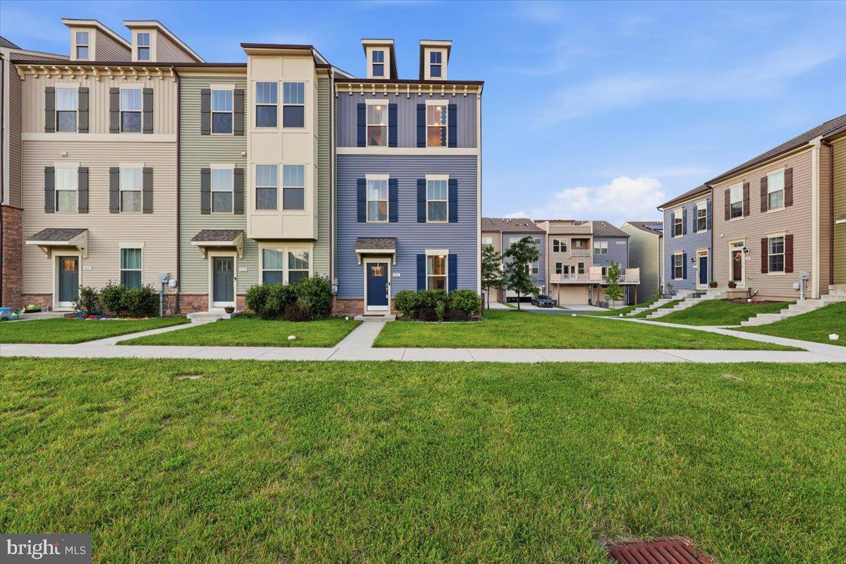 Beautifully maintained end-unit townhome with a two-car garage in the sought-after Tuscarora Creek community. This spacious home offers 3 bedrooms, 3 full bathrooms, and 1 half bathroom. The primary suite features a walk-in closet and a private en-suite bathroom with a beautifully tiled tub/shower combination, dual vanity sinks, and luxury vinyl plank flooring. The well-appointed kitchen showcases gray cabinetry, granite countertops, stainless steel appliances, and a large center island, making it ideal for both everyday living and entertaining. The adjoining dining area provides a convenient and inviting gathering space. Luxury vinyl plank flooring extends throughout the home, adding both style and durability. The lower level offers exceptional flexibility with ample space for a home office, recreation room, fitness area, or guest retreat, along with a full bathroom. Residents of Tuscarora Creek enjoy outstanding community amenities, including a clubhouse, swimming pool, walking trails, and playgrounds, providing a resort-style lifestyle close to everyday conveniences.