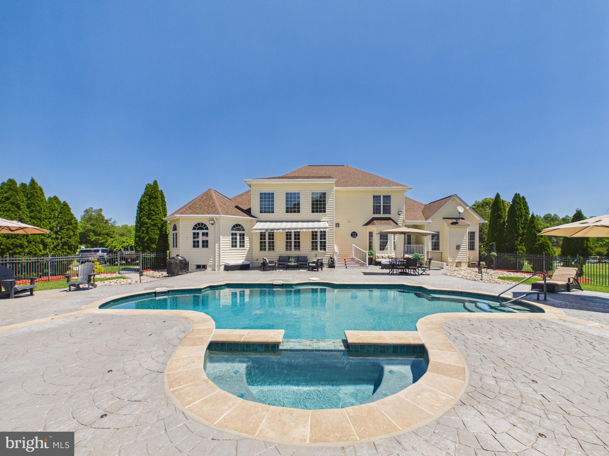 ** SELLER NOW OFFERING BUYER CREDIT TOWARDS CLOSING COSTS/RATE BUY DOWN WITH A SERIOUS ACCEPTED OFFER**
**LIST OF UPGRADES IN DOCS ($280,000 IN UPGRADES)
Set behind a private approach on 3.03 serene acres, this Northern Virginia Luxurious Estate delivers a rare combination of privacy, refined living, and resort-style outdoor design within reach of Washington, D.C.

A Rare Blend of Elegance, Privacy, and Lifestyle, Designed to Impress

The outdoor environment defines the property. A fully reconstructed saltwater pool and spa with upgraded Omni Logic automation system anchors expansive stamped concrete terraces designed for elevated entertaining. Mature landscaping, open green space, and thoughtful lighting create a true private retreat atmosphere.

Inside, the home offers main-level living convenience with a spacious primary suite and additional bedroom on the entry level. Over $275,000 in recent capital improvements provide exceptional turnkey confidence, including three newly installed HVAC systems, renovated bathrooms, upgraded lighting and fixtures, refreshed hardwood flooring, and a fully finished lower level featuring a private cinema and dedicated fitness suite.

Every detail reflects careful investment in both lifestyle and infrastructure, delivering immediate enjoyment without deferred maintenance concerns.
Strategically positioned along Virginia’s Washington–Richmond corridor and near major federal and executive employment centers, the region continues to benefit from expanding commercial investment and residential growth, including large-scale entertainment and hospitality developments such as the upcoming Kalahari Resorts & Conventions and new mixed-use initiatives throughout the I-95 corridor. Continued data and technology sector expansion in Northern Virginia,  including operations by Amazon Web Services, further reinforces long-term regional strength. 
For buyers seeking privacy, turnkey condition, and estate-level outdoor amenities in Northern Virginia, this property offers a compelling alternative to higher-priced luxury submarkets while remaining connected to one of the East Coast’s most dynamic growth corridors.

Private showings available by appointment. Executive relocation and international buyers welcomed. Furnished estate option available.