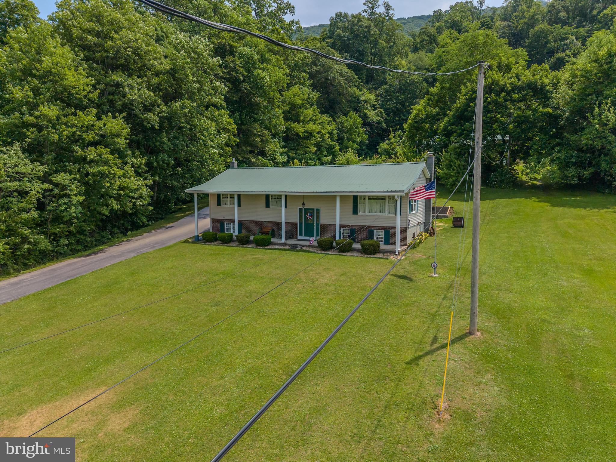 Nestled on 46 acres and bordering more than 16,000 acres of the Tuscarora State Forest, this exceptional property offers ideal combination of residential and recreational living! Whether you're seeking a full time residence, recreational getaway or investment property this unique offering delivers excellent possibilities. Features a remodeled 3 bedroom, 2 bathroom modular home with modern updates and views of the surrounding countryside and woodlands. Outdoor enthusiasts will appreciate direct access to thousands of acres near public land, ATV trails, and hiking opportunities right from the property. For hobbyists, contractors, or equipment owners, the property features a well equipped 29' x 38' shop built in 2012, complete with a concrete floor, heat, and elect service providing an ideal workspace year-round. An additional 22' x 30' garage/shop offers extra storage and versatility for vehicles, equipment, or recreational gear. The land itself offers some mature woodland with timber value. Additional features include an outdoor wood furnace, private well, public sewer and a paved driveway for convenient year round access. Ideally located just outside of Lewistown, minutes from Route 322, and approximately 30 minutes from State College!
