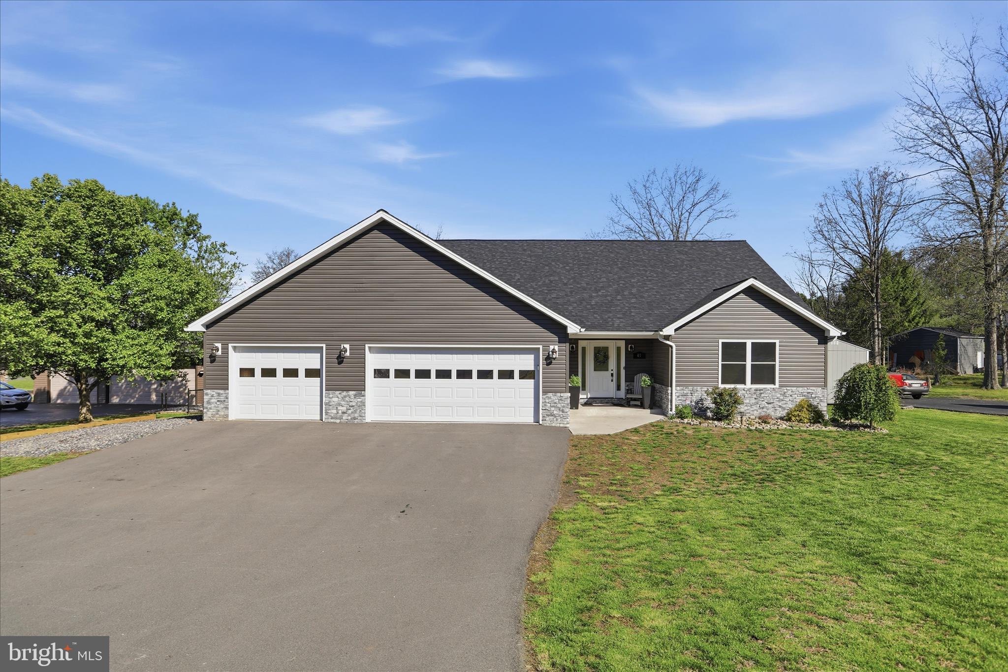 Beautifully built in 2022, this stunning 3 bedroom, 2.5 bath home offers the ease of single-level living in the highly sought-after Dowdens Addition subdivision of Fort Ashby! Featuring an open-concept floor plan, the spacious kitchen flows seamlessly into the dining and living areas, creating the perfect space for entertaining and everyday living. The kitchen boasts gorgeous granite countertops, a large pantry, and plenty of room for gathering. Cozy up by the fireplace in the inviting living room or enjoy the convenience of a dedicated laundry room. Outside, you'll love the covered back porch overlooking the fenced-in yard—perfect for relaxing, pets, or play. The oversized finished attached garage offers 2 bays with space for 3 vehicles, giving you plenty of room for parking and storage. Located just one mile from the heart of town, you’ll have quick access to the local market, restaurants, and all the small-town charm and amenities Fort Ashby has to offer!