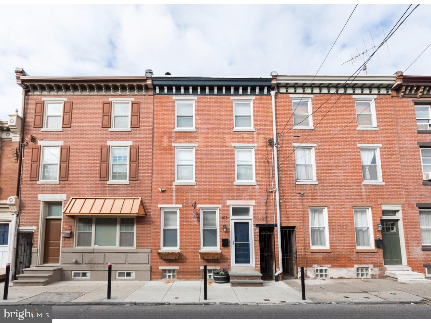 Seeking a home that combines modern amenities with old world charm and character? Look no further than this stunning, 3 bedroom, 2 bath Fishtown row-home that is situated on an amazing block within walking distance to the attractions of Frankford & Girard Avenues as well as neighborhood establishments like Loco Pez, ReAnimator Cafe, Philly Style Bagels, and so much more.  The stunning curb appeal is highlighted by the beautifully painted cornice, red brick facade, & window planters. When you enter the home, you will be greeted by an open living and dining area featuring exposed brick, built-in shelving, gas fireplace, beautiful hardwood flooring, and abundant natural light from the numerous windows. The spacious kitchen follows and includes a stainless steel appliance package, granite counter-tops, goose neck faucet and solid wood cabinetry. Very welcoming sitting/day room in the rear of the first floor that leads to the enormous back yard, which is perfect for gardening, grilling, & chilling. The master suite is located on the second floor and features an in-suite luxurious master bath, a gas fireplace, recessed lighting, and ample closet space. There is a laundry area, another generously sized bedroom and full bath also located on the second level. A third bedroom takes up the entirety of the third floor and comes along with access to the very large rear deck. Fully finished basement with wall-to-wall carpeting and all mechanicals, along with plenty of space for storage. This one won't last long, schedule your visit today!