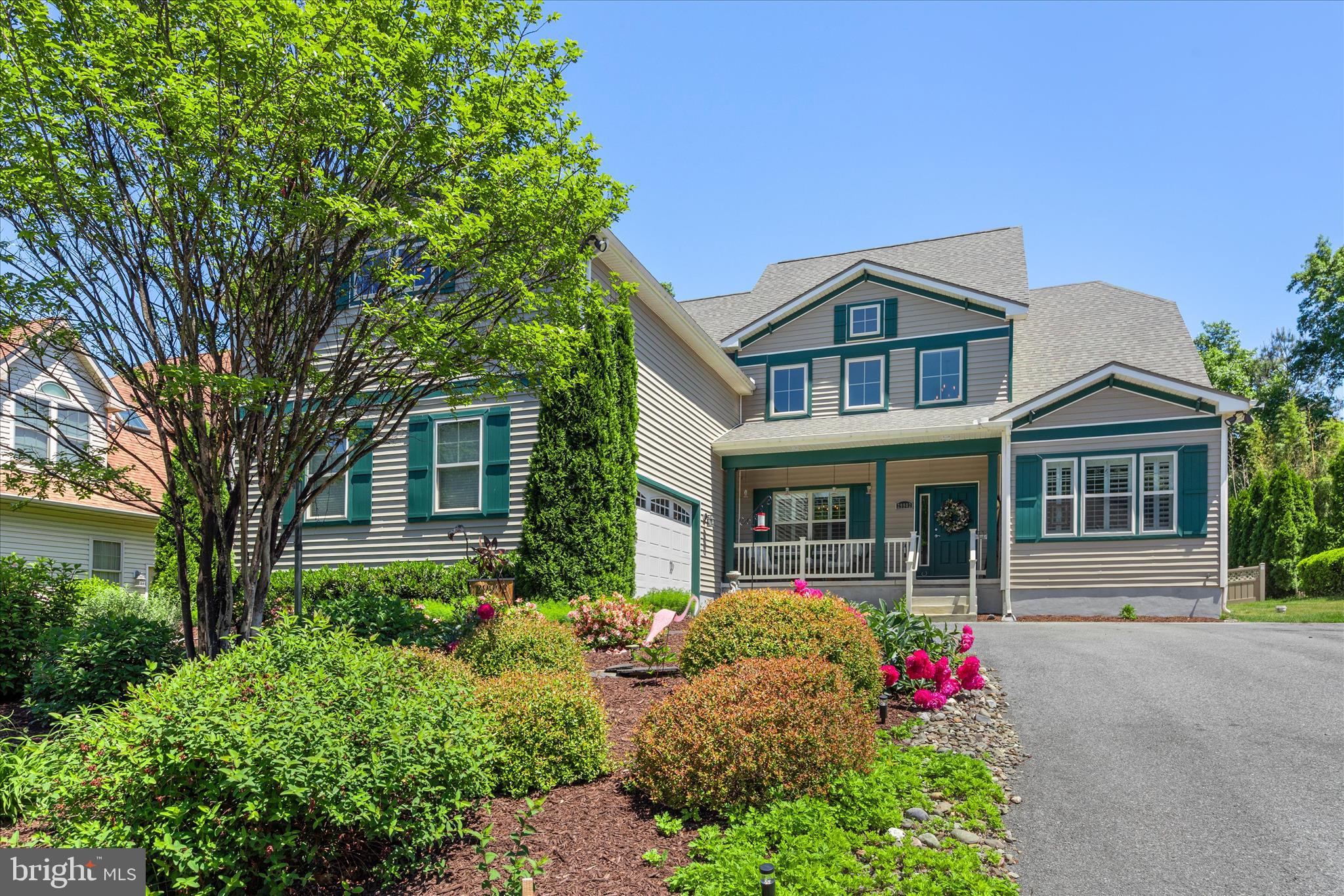 Welcome to 29902 Sawmill Drive in Bay Colony, a sought-after waterfront marina community along the Indian River Bay offering exceptional coastal amenities and a relaxed Delaware beach lifestyle. Residents enjoy a private marina with boat slips available for lease or purchase, a private bay beach, pool, clubhouse, tennis, and pickleball courts—plus Cripple Creek Golf & Country Club just across the street!

Thoughtfully designed for first-floor living and effortless entertaining, this spacious, beautifully updated home features soaring two-story ceilings, abundant natural light, and an open coastal-inspired layout. The dramatic great room is filled with sunlight from a wall of picture windows and clerestory windows, while the gourmet kitchen offers granite counters, generous cabinetry, deep pantry storage, stainless steel appliances, and a large breakfast bar. The main level also includes a formal dining room, sunlit breakfast room, private office, renovated powder room, mudroom, laundry room, and a luxurious first-floor primary suite with a beautifully updated bath and multiple walk-in closets with built-ins.

Upstairs offers a second primary suite with ensuite bath, three additional bedrooms, and a massive flex/recreation room ready for a game room, theater, storage, or additional gathering space. An oversized 22x38 attached garage with workshop area provides excellent space for hobbies, storage, and beach gear. Ideally located near Holts Landing State Park, great restaurants, shopping, and with easy access to major cities, this Bay Colony home offers space, comfort, amenities, and the best of coastal living.