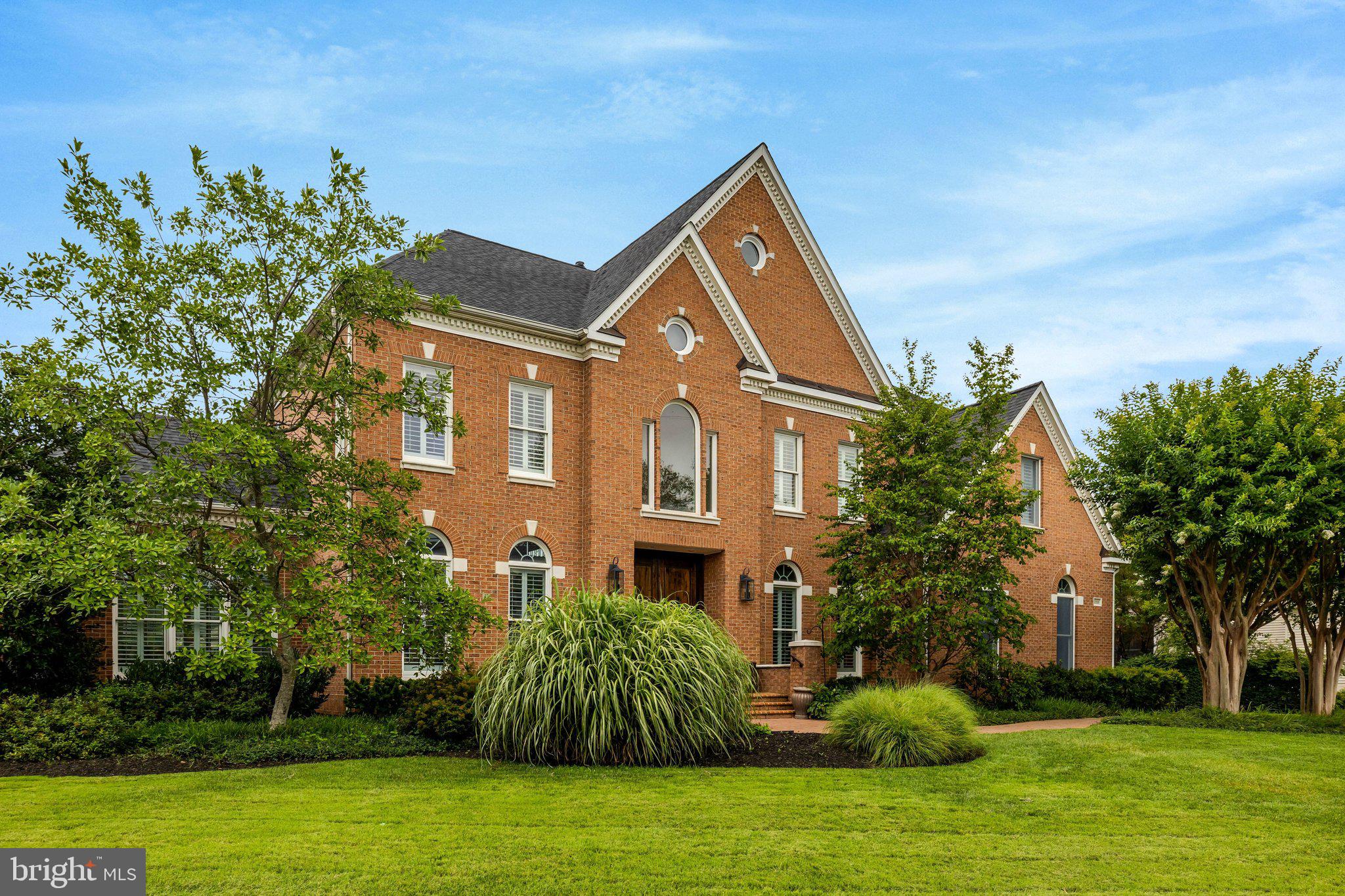Welcome to  one of Tysons Corner's most exceptional estate residences, offering the perfect balance of luxury, privacy, and convenience. Just minutes from premier shopping, dining, and major commuter routes, this remarkable property features nearly 8,000 square feet of beautifully appointed living space, a detached guest house, and parking for up to ten vehicles.

A dramatic two-story foyer opens to elegant formal rooms and a breathtaking great room with soaring ceilings, a striking stone fireplace, and walls of natural light. The renovated gourmet kitchen showcases Mont Blanc Brazilian quartzite countertops, custom cabinetry, and an exceptional suite of Sub-Zero, Wolf, and Bosch appliances.

The thoughtfully designed floor plan includes a main-level guest suite or office, a sun-filled solarium, and a luxurious owner's retreat with a spa-inspired bath and heated floors. The lower level is designed for entertaining, complete with a state-of-the-art home theater, expansive recreation space, and an additional guest suite.

Outdoor living is equally impressive, featuring professionally landscaped grounds, an expansive brick terrace with a built-in grill, and exceptional privacy. The detached guest house with a 15 foot ceiling offers approximately 1,200 square feet with a bedroom, full bath, kitchen size wet bar, laundry, and private garage—ideal for guests, multigenerational living, or a home office.

Meticulously maintained and thoughtfully updated, this extraordinary estate offers timeless elegance, exceptional flexibility, and a coveted Tysons Corner location that is truly second to none. New roof 2020. Welcome home!
