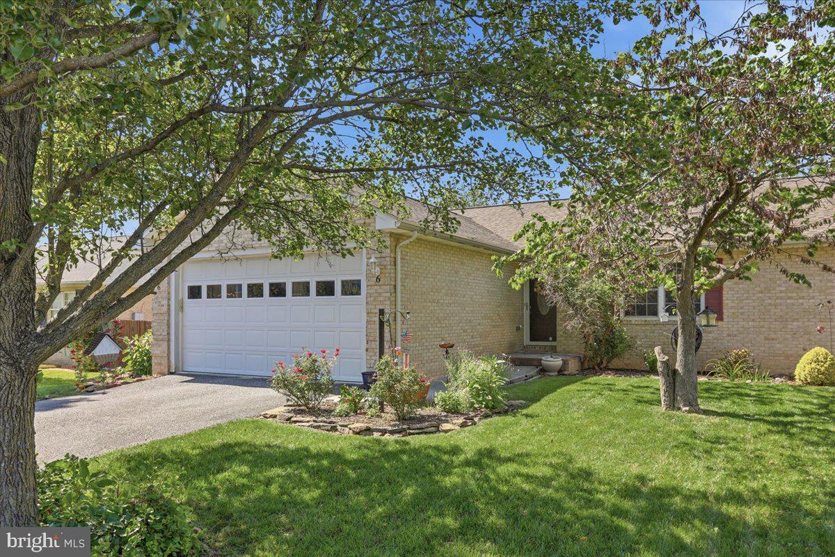 Well-maintained all-brick duplex offering comfortable one-level living with numerous recent updates and NO HOA. This attractive home features 2 spacious bedrooms, each large enough to comfortably accommodate a king-size bed, 2 full bathrooms, and an open-concept living and dining area highlighted by a cathedral ceiling that creates a spacious and comfortable living area.

The living room includes doors leading to a screened porch, perfect for relaxing or entertaining, with steps providing easy access to the fenced backyard. Additional features include a paved driveway, large garage, and a dedicated laundry room complete with a utility sink and extra cabinetry for storage. A large crawl space provides abundant additional storage space.

Recent seller upgrades include new carpeting in the hallway, living room, and dining room, a new kitchen tile backsplash, and fresh paint throughout the interior and on the screened porch (all completed in 2025); new kitchen countertop and installation of a chain-link fence (2021).

Enjoy the convenience of this home's functional living spaces and great outdoor area. This move-in-ready property is ready for its next owner and is ideally situated in a great commuter location, close to shopping, dining, and other local amenities.