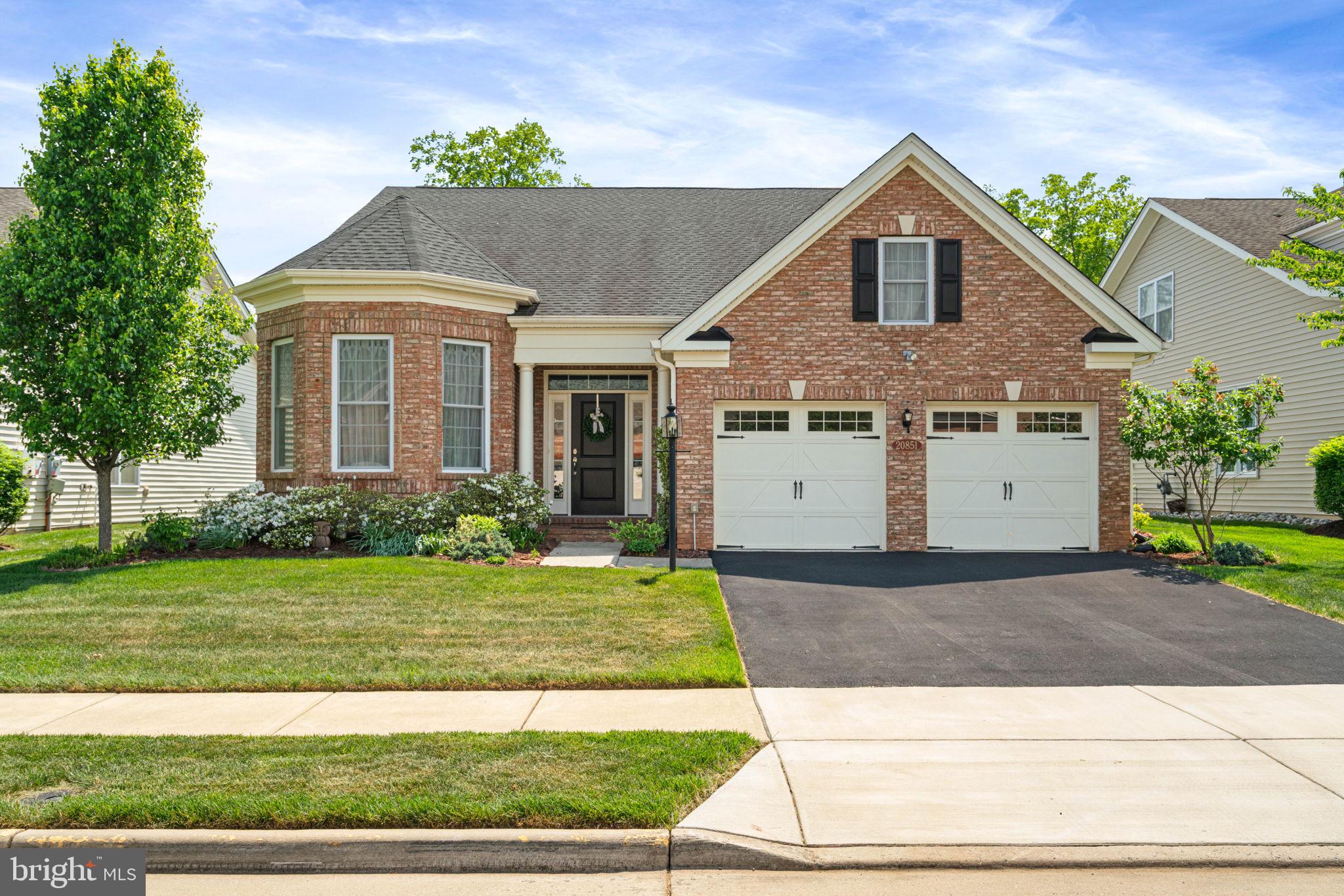 Welcome home to Regency at Ashburn. Looking for green space and nature views? Privacy? Modern luxury in a 55+ community? Then you have found your next new home. Regency at Ashburn is one of Loudoun County's best kept secrets.  Bright and sunny, this rarely available detached home is just waiting on her next owners. 
The highlight you ask? Your private, nature preserve-like setting with mature trees, wildlife, and pond views. But inside? Open-concept main level living, with primary and secondary bedrroms on your main floor.  Your spacious foyer welcomes you in with gleaming hardwood floors, fresh paint, and custom lighting. Gourmet kitchen with stainless steel appliances, separate pantry and beautiful granite counters are meant for entertaining family and friends. Open concept to your sunny eat-in breakfast room and family room with gas fireplace and soaring ceilings.   Step onto your covered patio and fenced back yard, it's the perfect spot for bird watching with your morning coffee. Separate dining room for holiday dinners, and french doors to your office/den give a quiet space to work or curl up with a good book. Your spacious primary suite boasts fresh carpet, beautiful primary bath with  walk-in shower, dual vanities, and large walk-in closet. Secondary bedroom, second full bath, and main level laundry/mudroom finish off your main level. Your second level boasts a spacious loft, your third bedroom and full bath complete with soaking tub and walk-in shower. Looking for even more? This home boasts a separate temperature controlled storage room above the garage off of the third bedroom, and  is just awaiting your creativity to see what you could make it.

Regency at Ashburn features an exclusive clubhouse with an outdoor swimming pool, fitness studio, and social spaces. Residents also enjoy full access to the broader Ashburn Village amenities, including a 32,000-sq-ft Sports Pavilion, indoor pool, walking trails, and lakes.  HOA covers lawn care, landscape maintenance, and snow removal.

Convenient to shopping, dining and entertainment at both One Loudoun and Ashburn Village. Walk to Pickleball and additional fitness activities at the nearby Ashburn Senior Center.  This idyllic location and home are truly special and must be seen to be appreciated.