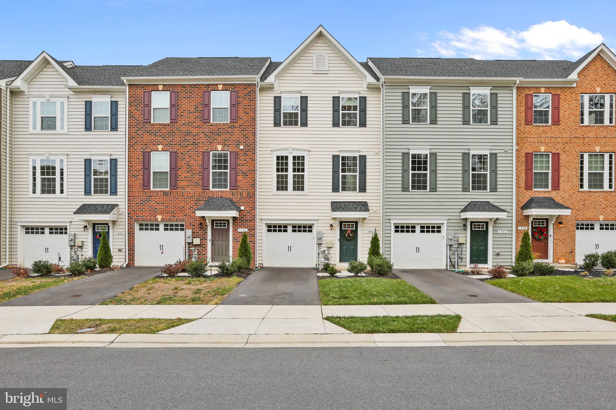 This charming townhome delivers 3 fully finished levels! The entry level features an attached 1-car garage, half bath, additional room walking out to the rear yard.  The main level features an open-concept kitchen and dining room area that flows seamlessly to your living space with a half bath.  Let's not forget the deck which is the perfect place to entertain family and friends.  The upper level features the primary bedroom, two additional bedrooms and two full baths.  This home has a bathroom on every level, tankless water heater, and upper level laundry area.  Other features include: smart thermostat, Arlo video doorbell, and is an Energy Star House.