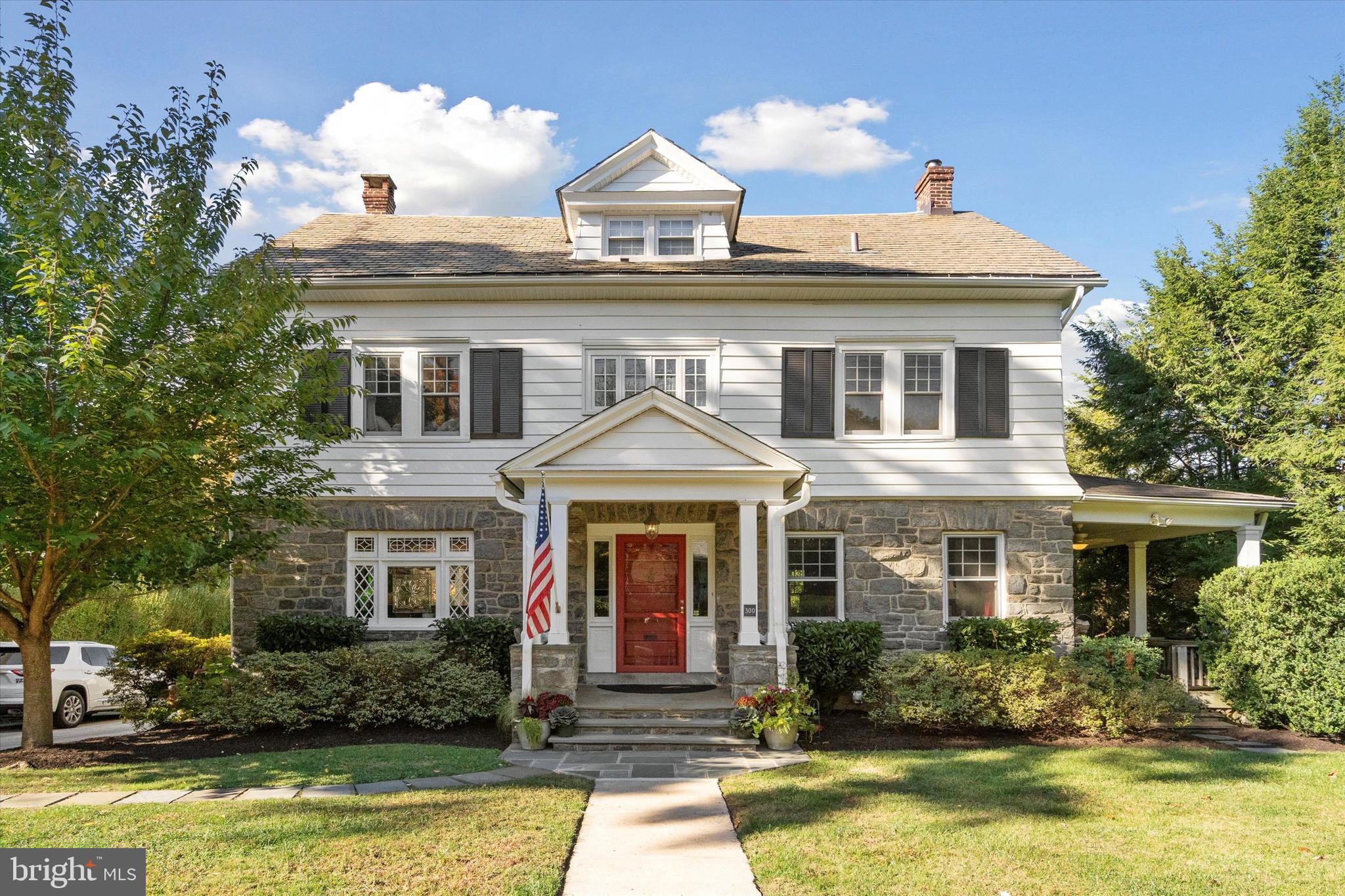 OPEN HOUSES CANCELLED!  Be Sure to Watch The Full Motion Video! Location, oversized lot, 7 bedrooms & finished walk-out basement! Nestled on a beautiful tree-lined street, 300 South Narberth is truly a special gem on a large lot (originally FOUR Narberth lots) on the desirable South side, seamlessly blending historic character with modern conveniences & essential system updates. Just a 3 block stroll to both Merion Elementary, the highest-ranking elementary school in LMSD, and a similarly short walk to charming downtown Narberth, with its delightful shops, restaurants & Septa train station. This location is simply unparalleled! After parking your car in the generous private driveway (with room for 6-7 cars), a charming covered front porch welcomes you home. Relax on 2 custom porch swings while watching the world walk by or retreat to your covered side porch that spans the entire width of the house and provides a perfect retreat as it is surrounded by mature plantings offering plenty of privacy! Step inside to discover a magnificent center hall, featuring a stunning staircase with 2 elegant landings leading to the 2nd floor. The 1st floor boasts a spacious living room ideal for gatherings, complete with working pocket doors, deep window sills, exposed beams & a cozy wood-burning fireplace that invites relaxation. Adjacent to the living room is the formal dining room, perfect for hosting dinner parties, which opens seamlessly to a thoughtfully renovated eat-in kitchen designed to maximize utility. From the kitchen, step outside to a generously sized, FLAT & fully fenced yard--perfect for throwing a baseball or hosting summer BBQs, creating an idyllic space for outdoor enjoyment. Completing this floor is a convenient powder room tucked under the stairs. On the 2nd floor, you'll find the primary bedroom featuring a decorative fireplace, ample space for a king bed and a large, adjoining walk-in closet. This level also includes 2 additional spacious bedrooms and a smaller room that is perfect for an office or nursery. The updated hall bath features an extra-long vanity with Cararra marble top & a frameless shower with 2 shower heads. The 3rd floor presents 2 more well-sized bedrooms, a laundry area & another fully updated hall bath, providing versatile options for family living, guest accommodations or additional office space. Descend to the remarkable lower level, which offers 900 square feet of additional finished living space (verified by appraiser), an easy walkout to the yard & bright daylight on 2 sides. It features a large open recreational room along with a functional kitchenette-like area, perfect for long term guests or backyard catering (just add a hot pad!). A separate bedroom or home office with emergency egress & a delightful full bath complete this level, making it an ideal in-law/au pair suite or simply a wonderful guest retreat. All of this plus a large driveway, perfect for playing basketball or parking a fleet of cars (2 wide in some spots)! Should you need a covered parking spot or just need more storage, this home also boats a 1 car detached garage accessible from Chestnut Street! Some of the major improvements to this home over the years of ownership include adding 2 zone AC, a fully replaced "stack" or drain line for entire house out to the curb, updated electric (no knob & tube here), all 4 updated baths, updated kitchen, insulation added to walls & attic and the list goes on! Windows on top 2 floors were replaced with highest quality true divided light, insulated, clad windows & the 1st floor windows were sensitively restored, reglazed & insulated to maintain the historic character. Unpack your bags & walk to the charming shops, thriving restaurants, delightful playgrounds & vibrant community events such as 4th of July fireworks, music & arts festivals, scavenger hunts & the Dickens Festival. Schedule your tour today to discover the magic of this remarkable property for yourself!