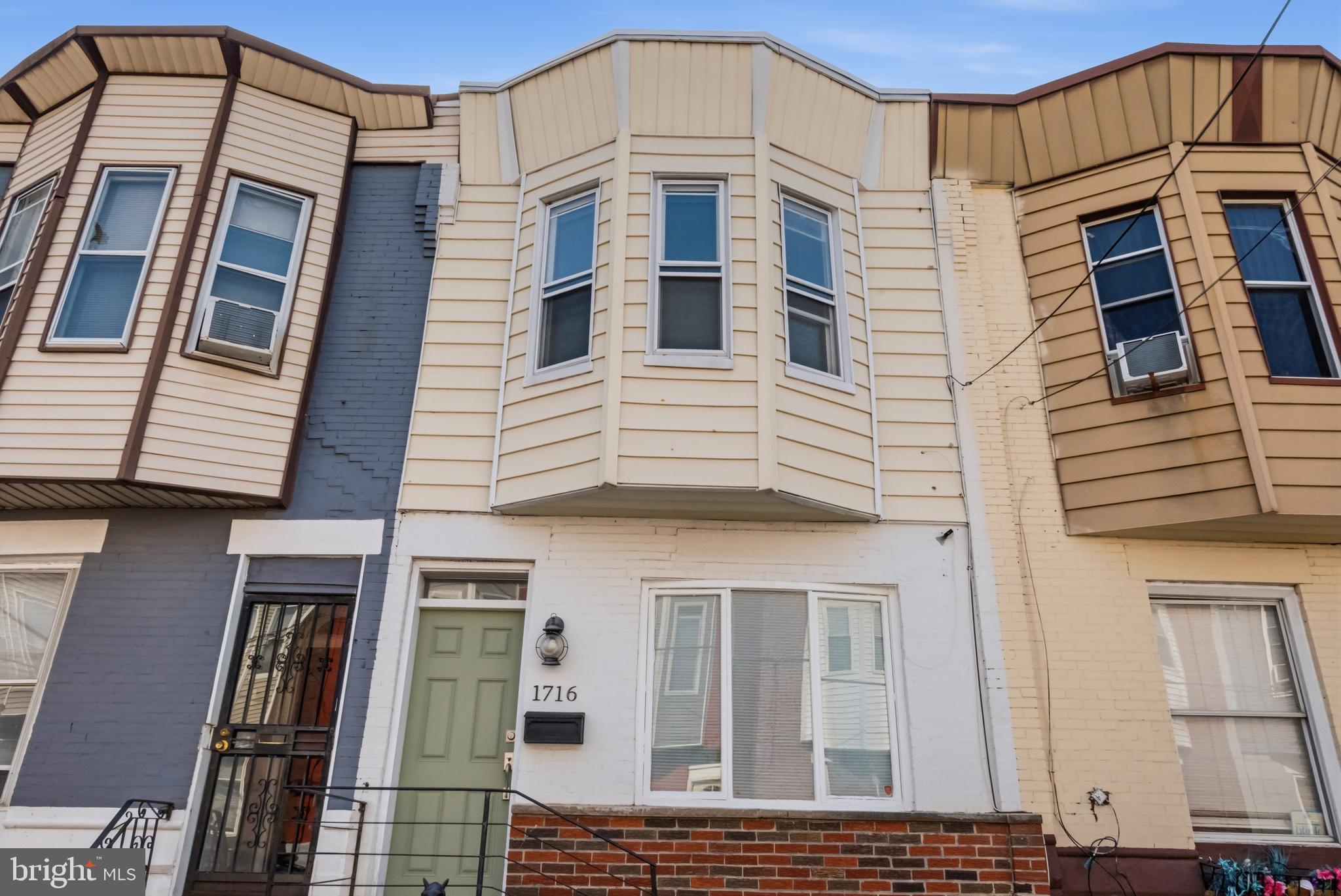Welcome to 1716 S Ringgold Street, a gorgeous, fully updated 3-bedroom, 1.5-bathroom row home nestled on a lovely block in the Point Breeze neighborhood. Step inside to an open-concept first floor where warm hardwood floors and elegant crown molding create a bright and welcoming ambiance. The main level features a convenient powder room and flows effortlessly into a custom eat-in kitchen. The kitchen features premium quartz countertops, ample cabinet space, Samsung stainless steel appliances, and Spanish-style tile details. Beyond the kitchen is a cozy breakfast nook. Upstairs, you'll find three comfortable bedrooms boasting ample closet space and excellent natural light. The bedrooms are served by a tiled hall bathroom. The full basement provides plenty of storage space and a laundry area equipped with an included smart washer and dryer. This home offers peace of mind with mechanicals that are less than 10 years old, including central air and heat managed by a smart thermostat, 100 amp electrical service, and stainless steel chimney liner, plus a brand new roof in the last year. Located just a short drive, bike ride, or walk to Center City, Rittenhouse Square, and local Point Breeze hotspots, this turnkey home is an absolute must-see!