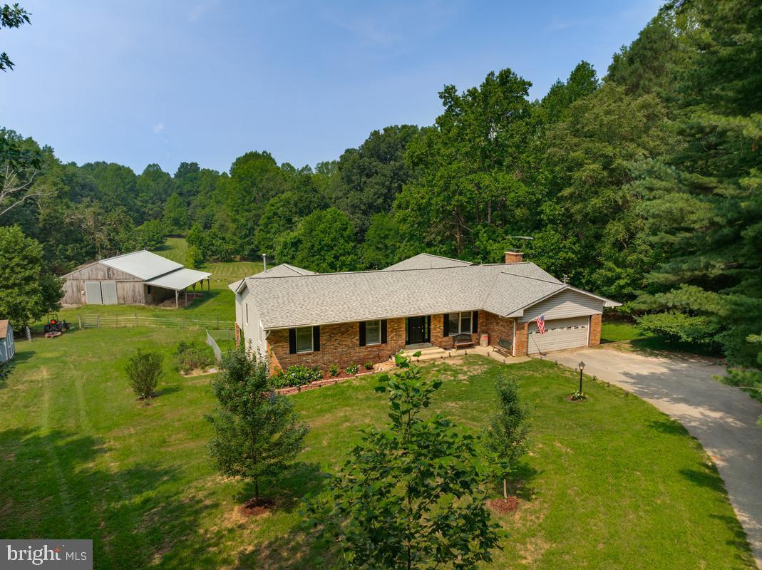 Prior Day's Notice due for Showings  *  PHOTOS coming 7/17 * Welcome to your private Farm retreat in Huntingtown — nestled on 10.25 acres surrounded by rolling hills and sweeping panoramic views. This property offers the perfect blend of country living, comfort, and functionality, with 3 fenced pastures bring the horses, chickens, goats, and more — all with no HOA.   6 Stall Barn features a new roof (2023), a 10+ foot overhang, 1 Birthing Stall, electric, 2 water spigots, and convenient utility access, making it ideal for horses, hobby, farming, storage, or workshop space.  Property includes open fields suitable for turnout and grazing with space for potential arena development or paddock expansion subject to county approvals.  A new shed was added in 2024 for even more storage. There are a few openings in inner paddocks, but entire barn area is fenced and ready for turning out horses.   See Ariel icon for land lot lines. 

This rambler is loaded with upgrades and flexible living spaces * 3 fireplaces, Main and Lower level kitchens , 2 laundry areas, and walk-out lower level perfect for entertaining.   The primary suite includes: Stone accented Gas fireplace * Spacious walk-in closet * Spa-style soaking jetted tub * Walk-in shower and Private laundry area.  Recent updates include: New carpet in 2 BRs (June 2026) New propane furnace (2025) New dishwasher (2025) New refrigerator and gas stove (2024) Updated stainless steel appliances and New well pump (2021) * The finished lower level offers a 2nd Kitchen, second laundry room, wood stove, generous entertaining space, and abundant storage.  This is your opportunity to own a manageable farm with privacy, functionality, and scenic beauty — a true Huntingtown countryside escape is just waiting to welcome you home.   Long PRIVATE DRIVEWAY * Please do not drive down or attempt to walk the land without appointment.  Showings Welcome with Appointments * seeking flexible Buyer with flexible settlement date * Sale MAY  be contingent on Seller Finding Home of Choice, flexible buyer would be ideal as to settlement date