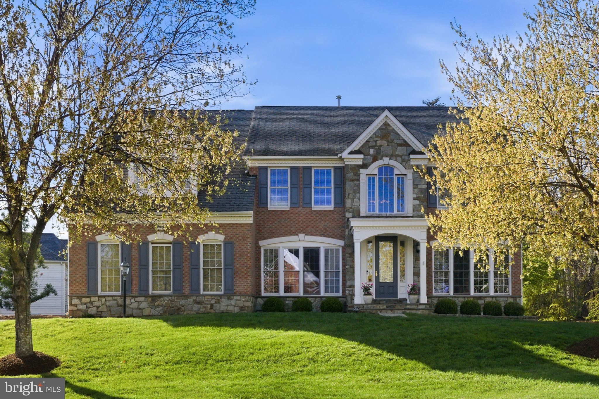 NEW PRICE!  It's a Great price for this neighborhood - check out the comps! COME SEE this  GORGEOUS home on a HALF ACRE HOMESITE!  OPEN  SATURDAY, 6/6  from 2-4pm Motivated Sellers!<br><p>

This warm and welcoming home offers BEAUTIFUL SPACES and timeless charm in the sought after UPSCALE NEIGHBORHOOD of FOREST MANOR. Light HARDWOOD FLOORS flow through the main level, leading to a STUNNING TWO STORY FAMILY ROOM featuring a dramatic floor-to-ceiling STONE FIREPLACE, statement chandelier and LARGE DECORATIVE WINDOWS that fill the home with NATURAL LIGHT. The main level offers plenty of spaces for living, dining and entertaining, including a SUNROOM and OFFICE.
The kitchen features GRANITE COUNTERS, STAINLESS APPIANCES (including a new SS Fridge), plenty of cabinet space, and a LARGE ISLAND, perfect for everyday living and entertaining!
Upstairs, the HUGE PRIMARY SUITE has vaulted ceilings, a sitting area, 2 CUSTOM WALK IN CLOSETS, and an elegant bath with DUAL VANITIES, a soaking tub, and a FRAMELESS  SHOWER DOOR. An additional bedroom with ENSUITE BATHROOM , plus two more bedrooms and a full hall bath, complete the upper level. 
A fully FINISHED BASEMENT adds even more living and entertaining space, and the STONE PATIO, and LARGE FLAT YARD s ideal for enjoying the outdoors. <br><p>
Located in the highly desirable BRIAR WOODS HS  - Eagle Ridge MS pyramid and just minutes to the ASHBURN METRO and Brambleton Town Center with great dining options, shopping, entertainment, and community events—this home offers an unbeatable combination of comfort and convenience.  Come see it!