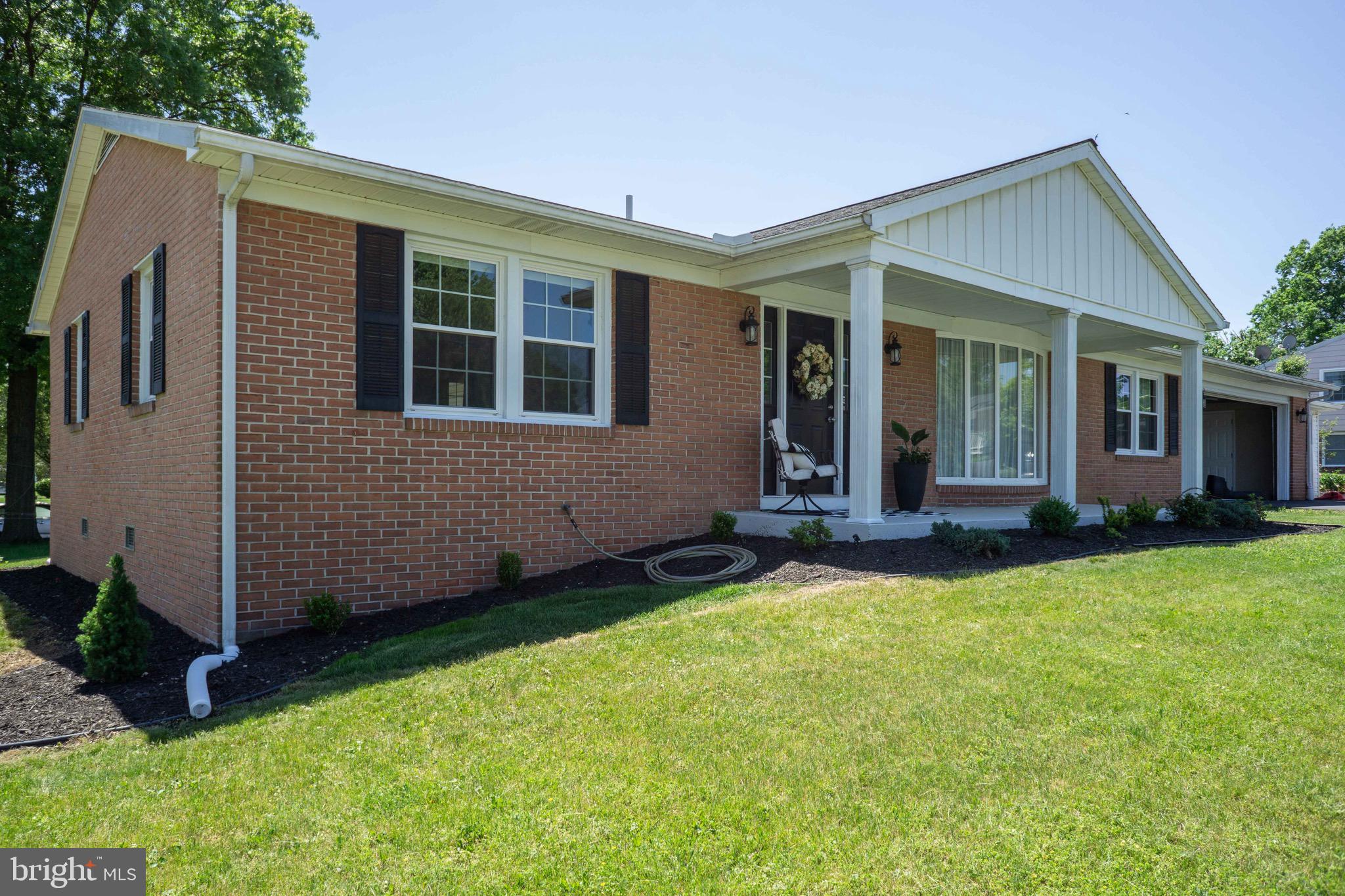 This immaculate brick rancher, situated on a spacious 0.28-acre corner lot, offers the epitome of one-level living with its thoughtfully updated and meticulously maintained features. The home boasts a luxurious master bedroom with an en-suite bathroom, and an eat-in kitchen that dazzles with cherry cabinets, granite countertops, a central island, a cozy coffee bar, and a charming fireplace. An expansive and versatile room off the kitchen, complete with a walk-in closet and full bath, can easily serve as a fourth bedroom or a family room with a pantry. Gleaming tile and hardwood floors run throughout the residence, enhancing its elegant appeal. Recent updates include newer windows, doors, a roof replaced in 2015, and modernized kitchen and bathrooms. The property also includes a spacious three-car garage. With no HOA fees and no city taxes, this commuter-friendly gem near I-70 and I-81 is a rare find.