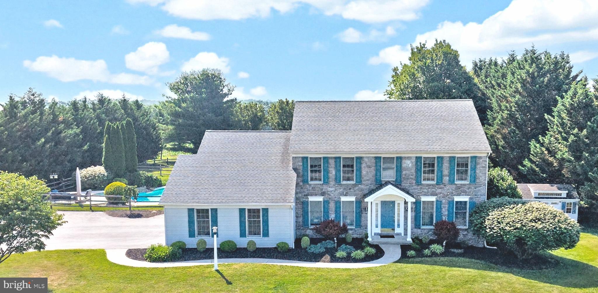 Cool off in style & vacation at home every day! Welcome to 435 Milford Road and resort-style living: heated In-Ground Pool & Spa with cascading waterfalls; multiple outdoor entertaining spaces; enviable 1.2+ acres of flat, grassy yards backing to trees and park-like open space; and no HOA! PLUS Downingtown East Schools and close to STEM Academy! Ideally located down the road from Marsh Creek Park, shopping, restaurants, Ludwigs Corner, Eagleview, PA Turnpike & Rte 100, more! Down a picturesque tree-lined driveway to this exceptional property, and the timeless stone façade framed with new shutters is just stunning. The covered front Porch leads into a Reception Foyer replete with hardwood floors and w/newly renovated Powder Rm and large coat closet. To the left is a Study/Bonus Rm with french doors, ideal as an office, playroom, music room, etc. To the right is the formal Living Rm leading into the spacious Dining Rm with ample space to comfortably host large gatherings & holiday celebrations. So many sophisticated upgrades throughout, including generously sized doorways, refined millwork and moldings, and abundant recessed lighting. The custom designed Eat-In Kitchen showcases: raised panel cabinetry & glass curios; bullnose-edged granite counters; curved center island with sit-up seating and extra cabinets/drawers; double sink with rubbed bronze fixtures; tile floors; large pantry; work alcove for organization station/work-from-home; more! Adjacent are the Breakfast Room and the Laundry/Mudrm w/access into the oversized 2-Car Garage (with pull-down stairs to attic storage) plus the expanded driveway for 6+ cars & all your recreational toys. Imagine game days, movie nights, or binging your favorite shows in this large Family Rm with upscale plantation shutters. WOW! --- the fabulous circular Sunrm/Florida Rm is a year-round retreat with its walls of gracefully arched windows framing the vibrant yards & gardens. It has tile floors; soaring ceiling with a fan/light fixture; and glass door opening to the stylish paver Patio & yards --- seamlessly blending the indoor living spaces with the beauty of the outdoors. Perfect for morning coffee, reading, relaxing after a long day, or intimate get-togethers. Upstairs is the Primary Suite, with sizeable Bedrm; 2 Walk-In-Closets + bonus closet; dedicated dressing vanity; and Full Bath with dual-sink vanity, shower, and linen closet. Down the hall are three more Bedrms (all with ample closets) and a hall Full Bath with tub/shower combo. The Full Basement has so much storage and is a casual gaming & fitness space, plus has the potential for whatever you can imagine. It also has gas runs for a future main floor fireplace or gas cooking. Outside is your own entertaining & relaxing oasis! Custom paver walkways and Patio showcase a charming pond area w/river stone; ornamental garden; stone-tiered waterfall; and colorful fish. The heated In-Ground Pool has a diving board; submerged seating area; and cascading waterfalls from both the tiered garden and the Spa, featuring soothing hydrotherapy jets. The surrounding concrete Deck has been freshly sealed with “Cool Deck” (slip-resistant/cooler underfoot) and offers a variety of inviting spaces for lounging & socializing. Flat, grassy yards back to trees & open space, and there are two fences with multiple gates: one around the pool complex and one around the rear yard (perfect for pets!). A stone pathway lined by hedges leads to the new shed, plus a tapestry of colorful gardens and expert landscaping surround the home, enhancing its stunning park-like setting. Upgraded & updated: roof; hot water heater; Trane HVAC; generator hook-up. Home is in outstanding condition but as a BONUS includes an AHS ShieldComplete Home Warranty WITH Pool Coverage ---  their highest level of coverage & peace-of-mind for you! Some photos virtually staged. Verification (including sq ft/size/lay-out/more) lies with the consumer.