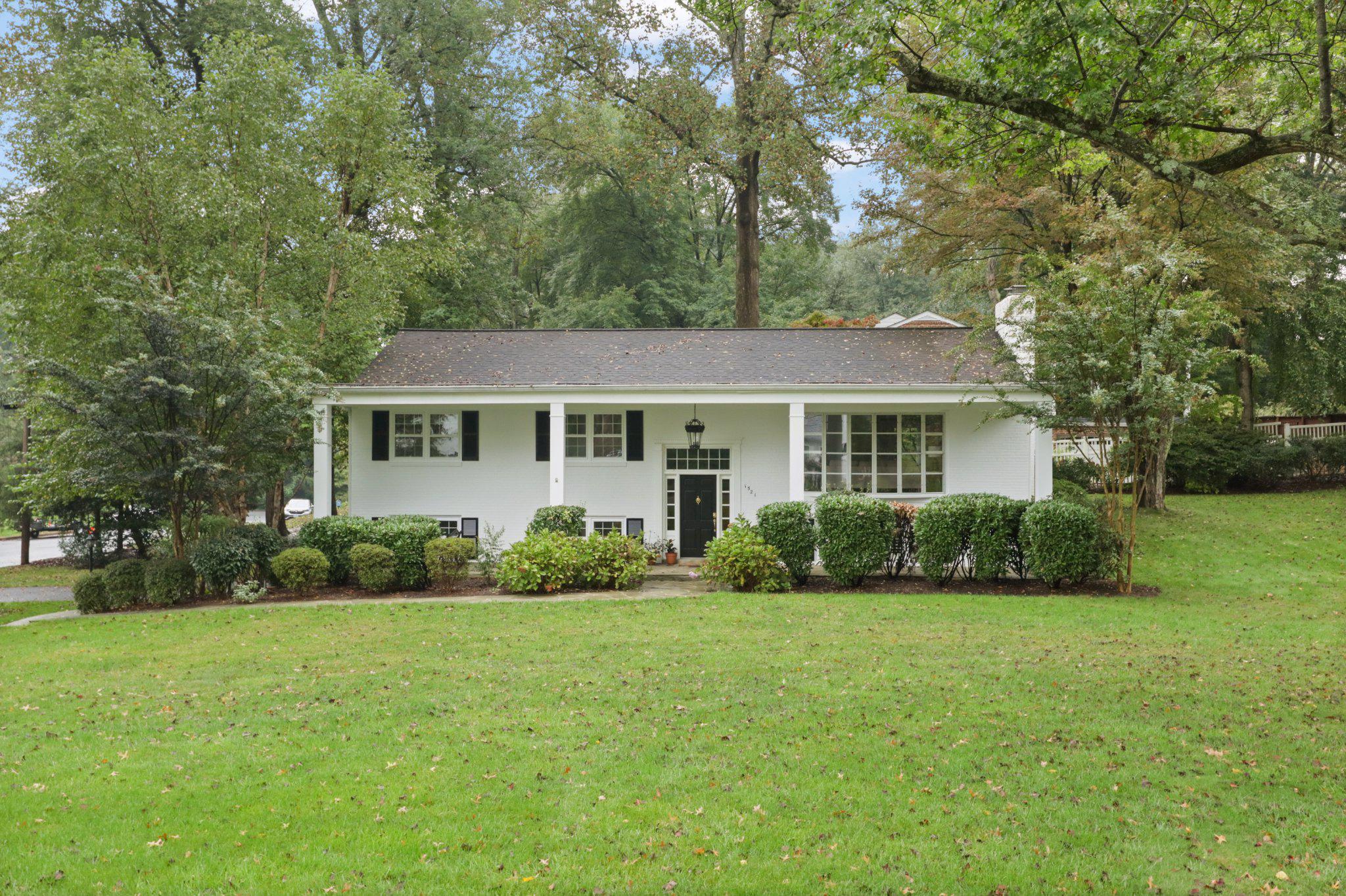 Welcome to this move-in ready brick home with Colonial Revival touches in the quiet, established Forest Villa neighborhood. Nestled on a spacious 0.7-acre corner cul-de-sac lot, this inviting property offers exceptional curb appeal with a welcoming flagstone front porch and beautiful mature landscaping.
The main level blends comfort and charm with hardwood floors throughout, featuring a formal living room and a light-filled dining room. The updated kitchen is designed for both everyday living and entertaining, offering granite countertops, stainless steel appliances, and a convenient walkout to a private patio where you can enjoy the shade of mature oak trees alongside blooming azaleas, hydrangeas, and dogwoods. Three bedrooms and two full baths round out the main level, including a primary bedroom with ensuite bath.
The lower level adds another 1,272 square feet of finished living space — bringing the total to 2,862 square feet — and features two additional bedrooms and a full bath, ideal for guests or extended family. A spacious family room with a gas fireplace creates a natural gathering space, while a dedicated laundry room, attached garage, and walkout to the driveway, add everyday convenience. The flexible layout is equally well-suited for a home office, recreation, or multigenerational living.
This home is zoned for the highly-rated Chesterbrook, Longfellow, and McLean High School pyramid and is ideally located a short bike ride or stroll to downtown McLean's shops and restaurants. With no HOA, easy access to major commuter routes, and the Silver and Orange lines just minutes away, the location truly delivers.
A rare financial opportunity accompanies this listing — an assumable VA mortgage at 3.5%. Buyer does not need to have VA eligibility to assume the loan. Please inquire for details.