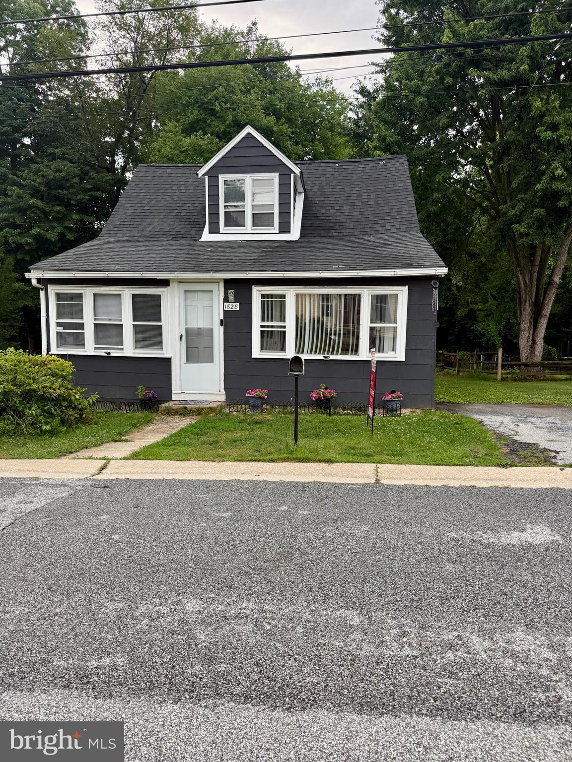 This charming Cape Cod offers 4 bedrooms and 2  baths and is ready for its next owner. The main level features two bedrooms, a full bath, a spacious living room, a dining area, and a kitchen with direct access to the rear porch. Enjoy your morning coffee or unwind in the evening with a good book while overlooking the beautiful backyard, shaded by mature trees and surrounded by a peaceful setting. The upper level offers two additional bedrooms, providing plenty of space for family, guests, or a home office. The basement is partially finished with a full bath, laundry, and a bilco door access to the outside. This home is located on a dead-end street.  The playground is located one street over. This home is conveniently located near a shopping center, restaurants, and major routes, Rt 322 and I-95. minutes from the PHL airport and the Wawa train Station. Schedule your showing today