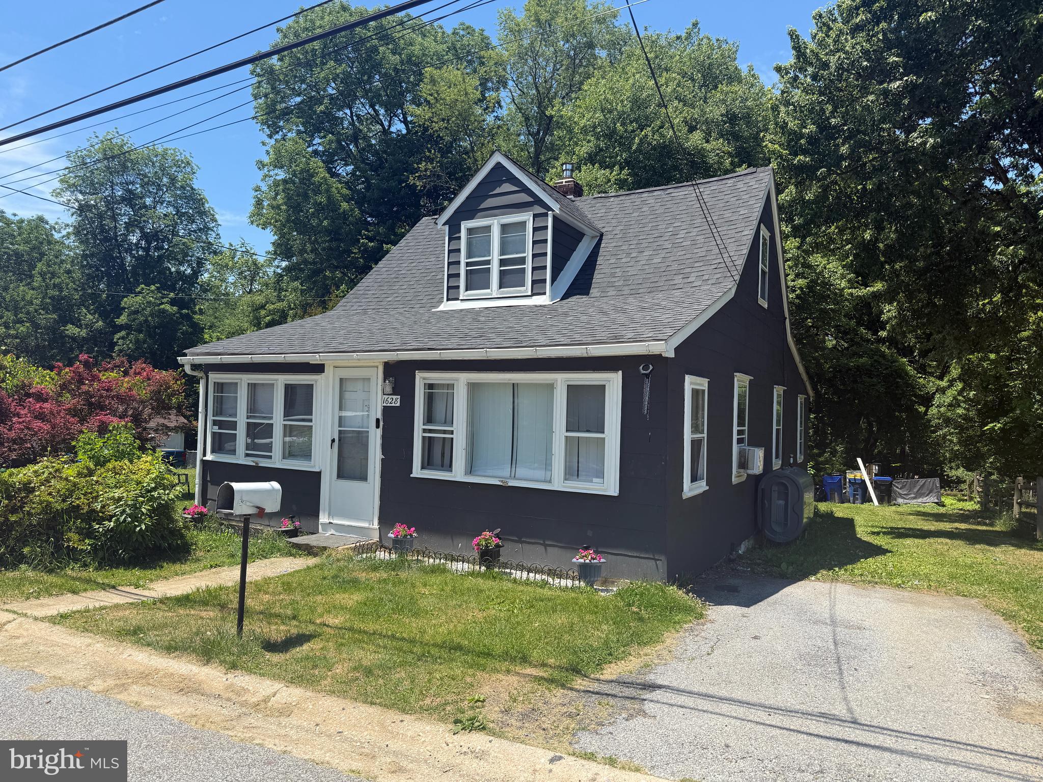 This charming Cape Cod offers 4 bedrooms and 2  baths and is ready for its next owner. The main level features two bedrooms, a full bath, a spacious living room, a dining area, and a kitchen with direct access to the rear porch. Enjoy your morning coffee or unwind in the evening with a good book while overlooking the beautiful backyard, shaded by mature trees and surrounded by a peaceful setting. The upper level offers two additional bedrooms, providing plenty of space for family, guests, or a home office. The basement is partially finished with a bath, laundry, and a bilco door access to the outside. This home is conveniently located near a shopping center, restaurants, and major routes, Rt 322 and I-95. minutes from the PHL airport and the Wawa train Station. Schedule your showing today