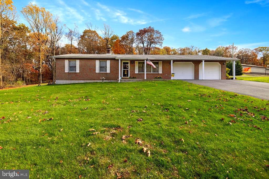 This home is perfect for anyone wanting to live on one level.  This well maintained 2 bedroom 2 1/2 bath ranch home is situated on a double lot and is close to the Maryland line, Ski Liberty, 2 golf courses, and Gettysburg. It has hook ups  for washer and dryer on the main floor if needed or as currently used in the basement.  The extra large lot is open and is great if you are a gardener and looking to grow vegetables or flowers.  Oak doors through out the house and oak cabinets in the kitchen feel warm and comforting.  Sit on your covered deck in the mornings and enjoy your favorite cup of coffee in this peaceful setting.  If you are looking to downsize, or just starting out, this house is what you need.