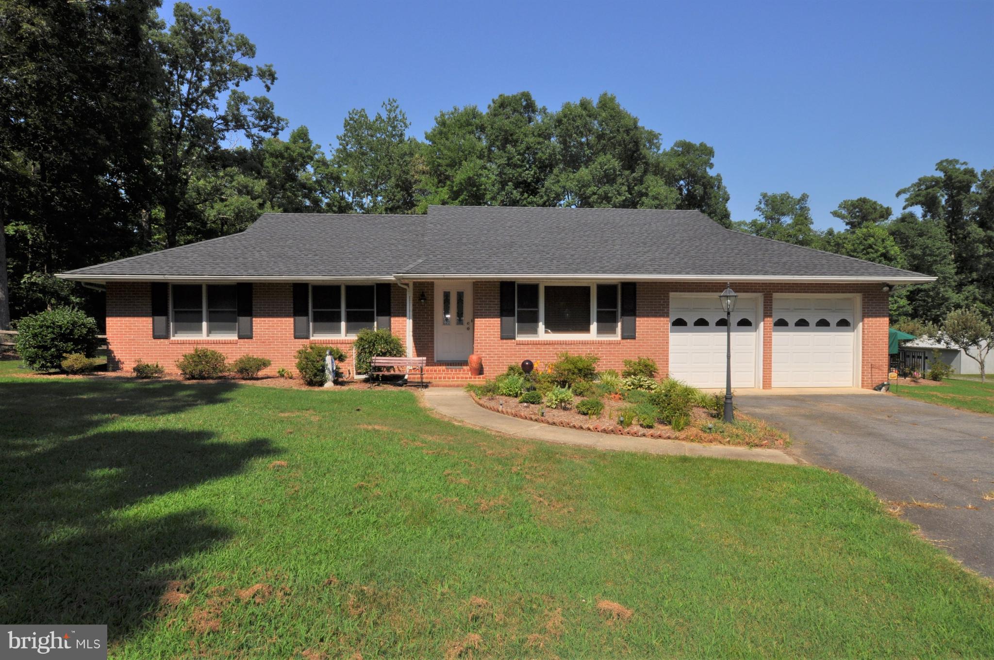 ALL BRICK BEAUTY w/ sparkling in-ground swimming pool is ready for you!  Enjoy summer evenings on the screened in porch -& lots of beautiful yard -over 3 acres! There's plenty of storage, too -w/3 large shed buildings & a 40x30 detchd garage/workshop. Inside features hardwood floors, new stainless steel appliances in kitchen & ceramic tile baths.There's even an office to work in! Come take a look!