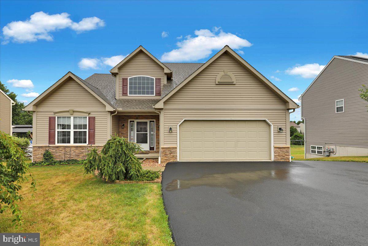Rare multigenerational opportunity! This exceptional 5-year-old home offers approximately 2,600 square feet of thoughtfully designed living space with 5 bedrooms and 3.5 baths. A truly rare find, the first floor features two private bedroom suites, each with its own full bath and walk-in closet - an ideal layout for multigenerational living,  dual owners, guests, or buyers planning ahead for aging parents. The spacious second floor offers three additional generously sized bedrooms and a full bath, providing plenty of room for family or visitors. The bright, full daylight walkout basement features 9-foot ceilings, abundant natural light, and rough-in plumbing for a future fourth bathroom, making it an outstanding opportunity to create additional finished living space. The well-appointed kitchen boasts granite countertops, modern appliances, and ample workspace for everyday living and entertaining. Step outside to enjoy the covered Wolf PVC deck overlooking the fenced backyard - perfect for relaxing or hosting gatherings. Additional features include central air conditioning, economical natural gas heat and hot water, first-floor laundry, a spacious family room with a cathedral ceiling and an attached two-car garage. Conveniently located near Jim Dietrich Park, shopping, restaurants, and major highways, this home offers the perfect combination of comfort, flexibility, and convenience. An outstanding value - replacing this home with new construction at this price would be extremely difficult. Don't miss this unique opportunity! Call today for more exciting details and to set up your private showing!