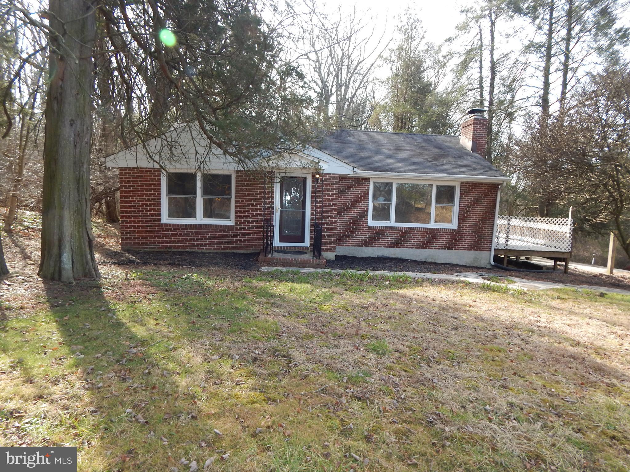 Recently renovated Brick Rancher on 1.5 Acres in sought after Glen Arm!  Welcome to the country life  and only minutes from everything.   Surrounded by pasture land, woods, fields and your very own babbling brook stream.  This 2 bedroom 1 bath features hardwood floors through out.  Cozy up to your large fireplace in your big Living room with large windows that bring in plenty of sunshine.  Separate dining room leads you into your new Kitchen with brand new appliances and plenty of cabinet space.  Huge, unfinished basement can be converted into a family room with an additional bathroom and possibly a craft room or office.
Enjoy the piece and quiet of the country from your large, screened-in porch or entertain on your side deck.  Close to everything you could need but away from the hustle and bustle.  1.5 acres of natural beauty and a great house at an unbelievable price in Glen Arm.  WOW.  This will not last long.  Come visit and you will not want to leave!