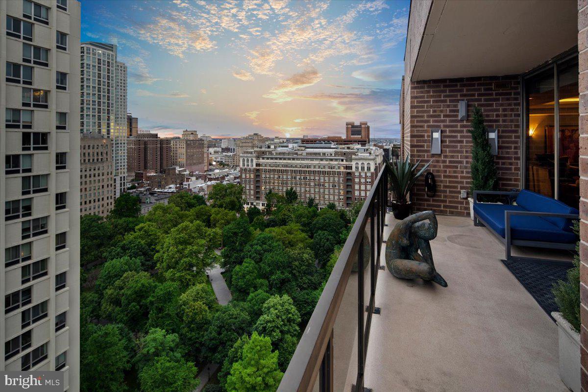 Welcome to Penthouse 2505/2406 at Independence Place located on scenic Washington Square. This rarely available bi-level Penthouse was redesigned by KJO Architecture LLC and went through a complete renovation in 2015.  The open concept first floor is an entertainer's dream!  From the minute you walk through the door you are taken back by the never-ending, unobstructed, 180-degree views from the floor-to-ceiling windows that provide a plethora of natural light.  A chef's kitchen complete with a butler's pantry and gorgeous built-in cabinets for displaying glassware is perfect for all your hosting needs! Featuring appliances by Frigidaire, a wine fridge by Gaggenau, and custom cabinetry in Macassar Ebony Veneer with custom lighting within.  The main living and dining room is an open space with a gracious, west-facing, wrap-around balcony that offers a captivating sunset view overlooking Washington Square.  It is uncommon for a condominium to have a wood-burning fireplace, but in this custom penthouse you will find a magnificent one in the corner of the living room area, giving the room a cozy vibe!  Off the kitchen is a custom-built home bar with Ebony Veneer where you can sit and enjoy unobstructed views of Philadelphia and the Delaware River.  A 1051-capacity bottle wine storage with a lighted display area and Ponderosa Pine doors (with a faux macassar finish) flanks one of the living room walls.  Down the hall, you will find a home gym with a full bathroom conveniently located across that can easily be converted into one or two bedrooms. Also located on the upper level is a large laundry room and powder room. The lower level is a sumptuous primary suite with a walk-in closet, private balcony, and well-appointed bathroom. The main bedroom features custom veneer cabinetry surrounding the gas fireplace and floor-to-ceiling windows with breathtaking views of the river and beyond.  The entire floor boasts Porcelanosa tile flooring.  The primary bath has radiant floor heating, two private bathroom stalls, an oversized shower with multiple shower heads, and a heated towel rack.  There is a double vanity with stainless steel sinks and lighted Reoburn medicine cabinets. All the tile is by Porcelanosa and the light fixtures by Sonneman.  With two storage/walk-in closets on the lower level in addition to another oversized closet by Closet Works this unit is not lacking any storage. Additional home features include a security system, Lutron shades on all windows, a central vacuum, hidden Sonos speakers throughout, antique lighting fixtures, a whole home audio system, and new floor-to-ceiling windows in the bar and living room. The residents of Independence Place enjoy 24-hour doorman and concierge, a brand new beautifully appointed lobby with a new state-of-the-art fitness center, and on-site property management in addition to on-site parking with direct access from the building (additional fee of approx $400/car).  Located on Washington Square in the Society Hill neighborhood of Philadelphia this area is immersed with fine restaurants, historic venues, and theaters!