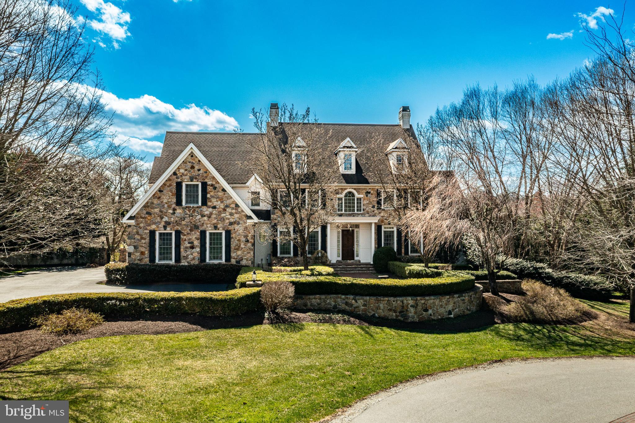 Welcome to 403 Woodale Drive, an exquisite 8,200-square-foot estate in the heart of Kennett Square., situated on 1.4 acres. This luxurious 5-bedroom, 6 full-bath, and 2 half-bath home offers unmatched elegance and comfort, with each bedroom featuring its own en-suite bath. The master suite is a private oasis, complete with a sitting area and a spa-like bath. The main level stuns with 10-foot ceilings, arched doorways, and pillar-framed openings, adorned with custom moldings and mahogany and marble flooring. The chef’s kitchen is a dream, with a Sub-Zero refrigerator and Wolf range. The finished lower level offers a game room, TV lounge, and workout space. Outdoors, enjoy a professionally designed landscape by Wallace Landscaping of Chadds Ford, an in-ground pool, a trellis, and a pool house with a fireplace and cabinetry. This home is also equipped with a Generac whole-house generator, two hot water heaters, and three HVAC systems, plus a spacious three-car garage. This is truly a one-of-a-kind masterpiece—your dream lifestyle awaits!