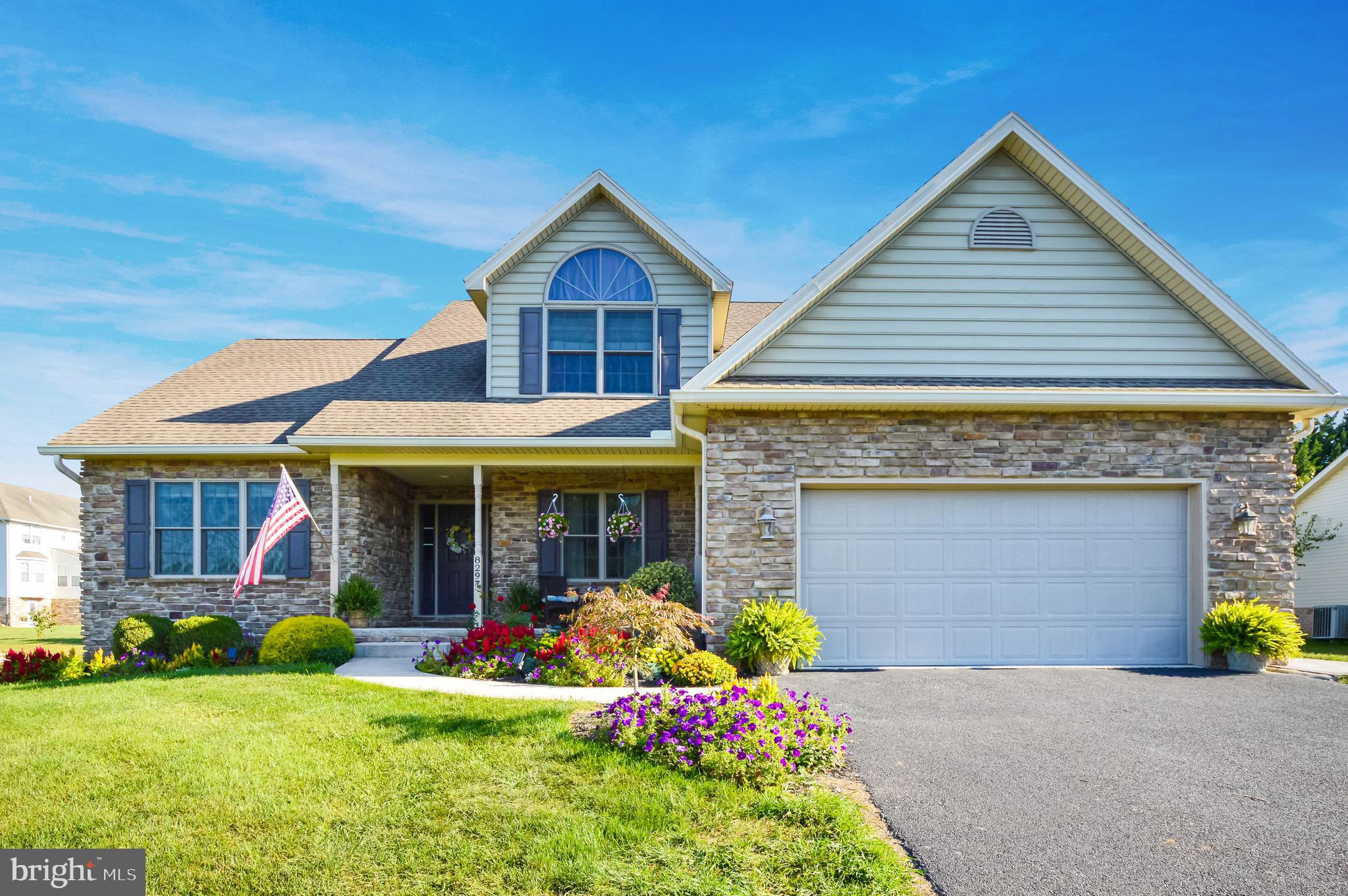 *3D Tour Available!* Picture yourself in this impeccably kept, quality built home! The photos show just how stunning the curb appeal is on this 1.5 story, stone and vinyl home. Landscaping made easy with a watering system in place for plants and beautiful flower beds already in place. The front porch makes for a nice sitting area if you'd like to watch the sunset, or just to have some cover from rain and sun when greeting guests at your front door.
 
Heading inside, you step in right onto the timeless hardwood flooring and look to see the living room's 14 foot ceiling and cozy gas fireplace. To the right of the entry is a formal dining space for all your holiday gatherings or just for everyday meals. Before getting to the kitchen you'll pass the half bath for guest use on your right and the basement interior access on your left. The kitchen is one you'll love to brag about with dovetailed custom cabinets by Hess that reach the whole way to the ceiling, expansive granite countertops, neutral tile backsplash and LVT flooring. A new gas stove that has convection and air fryer modes was just installed in 2024. A nice eat in dining space rounds out the kitchen area. Also on the main level is a large laundry room which has a deep laundry sink, cabinets for storage and a broom closet before leading out to the oversized garage. A side entry door makes it easy to head outside for any chores or just to walk around to the yard. Then last but certainly not least, the main floor owner's suite is what you've been searching for! With a ceiling fan, walk in closet, double sinks in the bathroom, a jacuzzi tub and a walk-in shower with a seat, all your boxes should be checked.
 
Upstairs there are 2 more bedrooms, both with ample closet space and ceiling fans. A 2nd full bathroom provides a tub/shower combo. The front bedroom has a semi circle window for extra pizzazz and 11 foot cathedral ceilings. Don't stress about temperature control either because a second heat pump zone services this level. So heat and cool as needed to control separately from downstairs.
 
The basement is partially finished with carpet and vinyl floorings plus 9' ceilings with 8' drop ceiling and no support posts in the way and has a 3/4 bathroom for convenience. Use the space as a rec room, home gym, home schooling space or play area. There's also a nice sized room that makes a fantastic home office, den, library, etc. The 68k BTU pellet stove will make the lower area nice and toasty in the winter plus there's a return in the basement hooked to the first floor HVAC if you'd like to distribute that heat to the main level. Even with all this finished space, there's still a large unfinished storage room with plenty of shelving  and has a chute from the garage to make transporting pellets downstairs a breeze. If gas fireplaces are more your style, there's an existing gas line already in the basement. Lastly, there's a "bilco" style exit from the basement to the backyard.
 
Speaking of the backyard... Entertaining space is here with a vinyl rail, wooden deck that is shaded in the afternoons. Plus a dry-lay patio that was just installed this summer which wraps around to the side garage door. A raised bed garden is in place next to the Northern Mountain Structures shed. Corner pins already available in the ground.
 
A few other things you'll like to know: Heat pump updated in 2016 for lower level. Insulation in floor joists for first floor. Water heater is 80 gallons and installed in April 2021. 2x6 exterior walls. Double pane Andersen windows. No HOA but deed restrictions do exist.