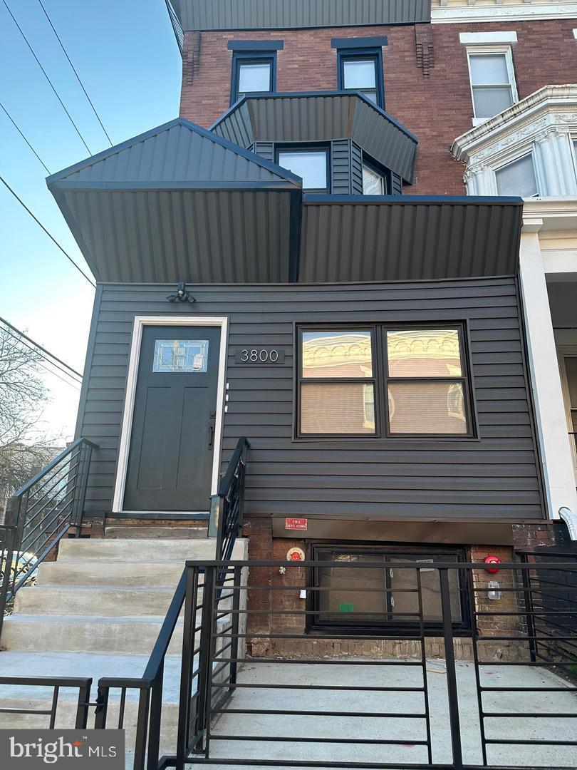 Welcome to 3800 N 18th St — a fully renovated gem offering modern comfort and investment potential. This beautifully rehabbed property features four units, each with 2 bedrooms, 1 bathroom, and central air and heating. The kitchens are outfitted with sleek quartz countertops, glass mosaic and subway tile backsplashes, and durable ceramic tile flooring. Throughout each unit, you'll find elegant hardwood floors, while the bathrooms showcase stunning floor-to-ceiling tile for a luxurious touch.  Each unit has washer/dryer hookup.  The fully finished basement functions as the lower level unit. A fantastic opportunity for investors or anyone looking to live in one unit while generating rental income from the others.  Seize the opportunity today, property equipped with sprinkler system and hard wired smoke alarms!!!