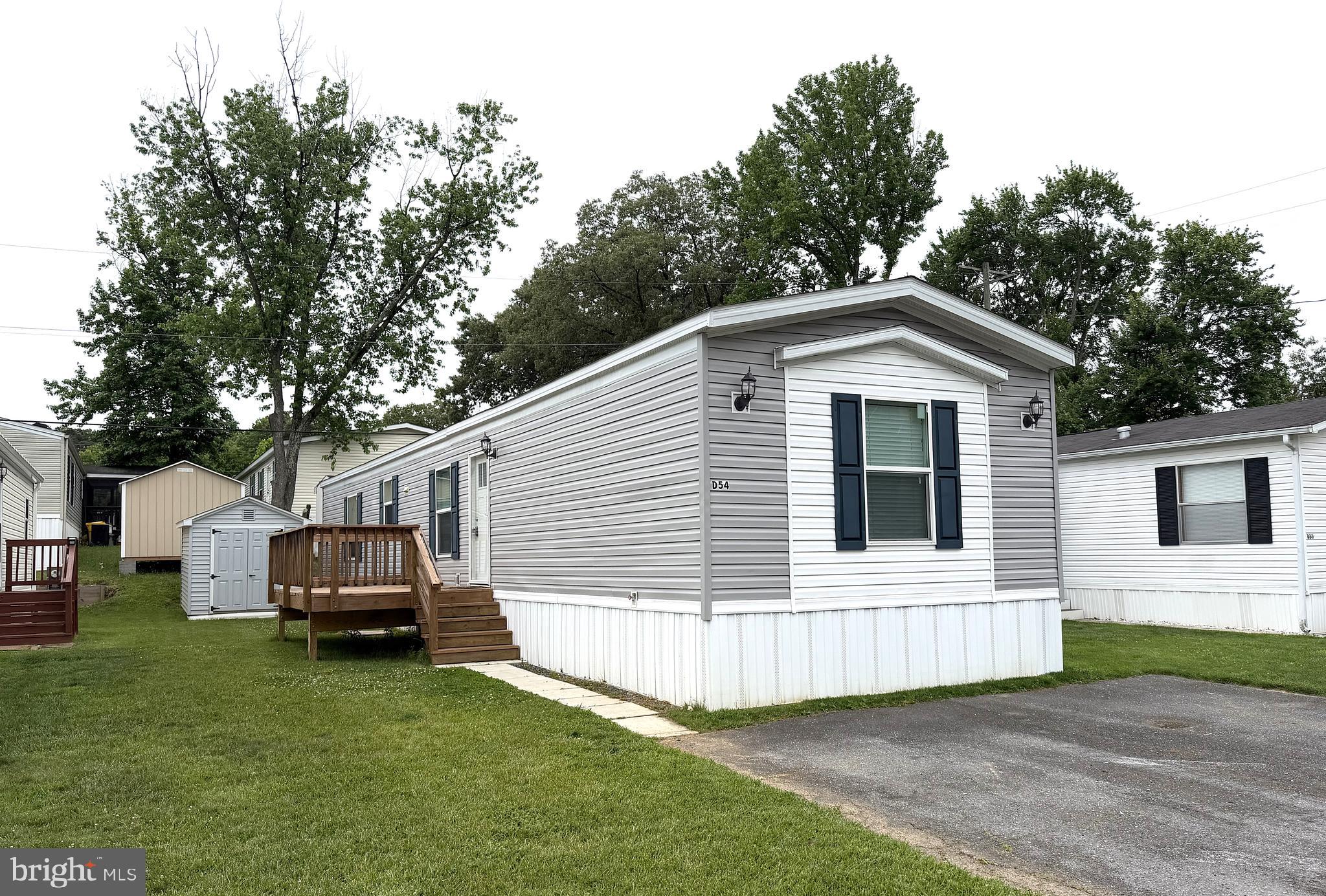 Beautiful and Spacious Single Wide in Sought After Holiday Mobile Estates! Built in 2023 with Over 1000 Square Feet and in Great Condition. Enjoy Preparing Meals in your Big Eatin Kitchen with Plenty of Cabinets, Counter Space, Pantry and Breakfast Bar. Ther are three Bedrooms with a Large Primary Suite Featuring a Private Bath and Walkin Closet. Relax in your Big Living Room with a Builtin for your Big Screen TV. Outside there is a Custom Sundeck and Secure Storage Shed. Close to Schools, Shopping, Restaurants. Just minutes to Fort Meade, Arundel Mills, MD Live and Rt 100. This one is not going to last. Contact me today for a Private Viewing.