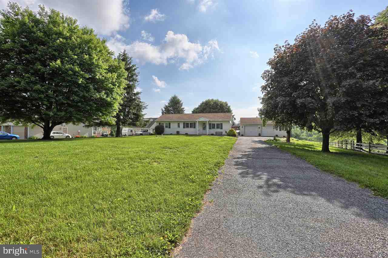One Story living in scenic setting! 3 bed, 1.5 bath, open floor concept country home on .62 of an acre! This home boasts central air, 3 season room, and a detached 2 car garage with electric. Basement has a finished family room with new acoustic ceiling, and new hot water heater. Home contains unique touches for added character. Don't miss this one!