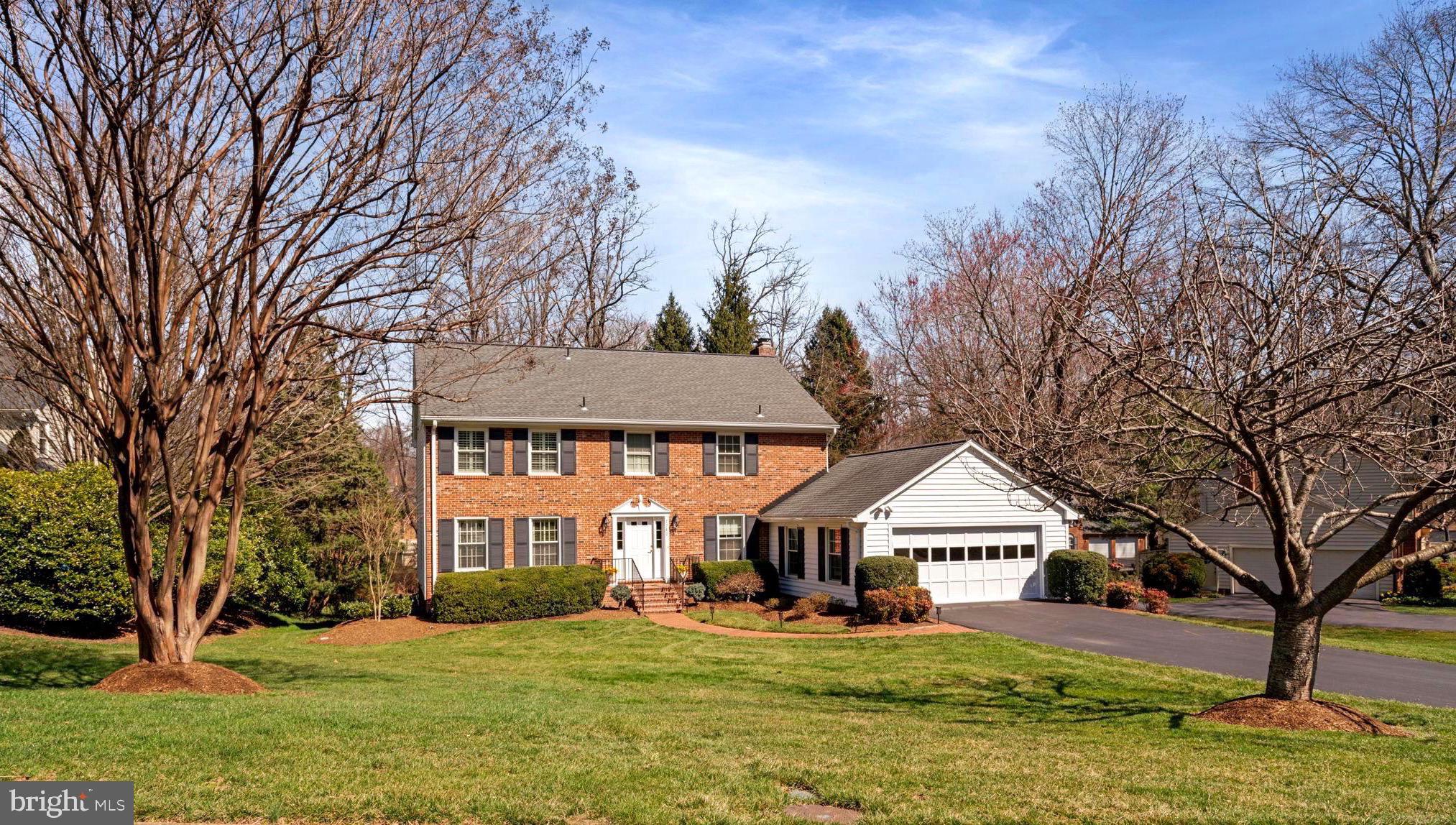Located on graceful .47 AC backing to community parkland in Bridle Path Manor (exclusive enclave of 10 solidly crafted homes distinct from but adjacent to McLean Hunt). Exceptional 4-BR, 3.5 BA Colonial offers finest updates, expansion, finishing. Two front yard Kwanzan cherry trees join neighborhood's breathtaking annual chorus of pink blossoms. Approx 4,500 fin sq ft on 3 levels ( and approx 365 sq ft unfin) boast main level hardwoods+upper level hardwood under carpet. Most major systems recently replaced: Roof, 4 skylights, gutters, Carrier gas furnace, CAC,  elec panel, 2 sliders, front door w/sidelights. Custom built-ins add special character to Liv Rm, cath ceiling Kit, main level Fam Rm and all 4 BRs. Abundant recessed lighting, 2 cozy FPs, security system+generator ensure yr round comfort and safety. ** MAIN LVL: Welcoming Center Hall Foy opens to grand piano sized Liv Rm, ½ BA,  stunning Kit and main level Laundry, with convenient passage to spacious 2-Car Gar. * The high end Kit will please the most exacting gourmet chef w/hidden Sub-Zero refrigerator cabinet, microwave drawer, Thermador 5-burner gas cooktop, Bosch double convection ovens, soft-close cabinetry w/pull out drawers+lazy susan, granite center island+countertops, instant filtered hot/cold water, walk-in pantry, built-in desk, clerestory window, ceiling fan. Sunny eating area beneath 2 skylights+sliders to Deck provide graceful views of sculpted rear garden sanctuary. Relax in peaceful beauty of lush, professional landscaping, mature trees, velvet lawn fed by underground sprinkler system. * French doors from Deck open to adjacent Fam Rm w/built-in cabinetry and FP, inviting peaceful evenings snuggled by the fire, playing favorite board games or curled up w/good book. * The beautiful Liv Rm overlooks elegant, formal Din Rm.  Lovely garden views through wide bay window infuse DR w/natural light, providing perfect setting for special repasts. ** LVL 2: Luxury Owner's Suite will be favored retreat. Warm, enticing king-sized Primary BR enjoys stunning, ensuite ceramic tiled BA  w/fabulous garden window overlooking rear oasis. Two skylights over jetted tub chase away cares while soaking in sunshine or under stars, plus separate seated shower and dual sinks. Custom Walk-in Closets keep clothes, shoes neatly organized, readily accessible. * Three additional BRs (one w/charming window seat) feature high-end, custom built-ins in BRs  and closets. * 2nd Full BA is distinguished by spacious countertop, ceramic tile floor. ** LOWER LVL: Full, finished Walkout Lower Level, w/newly remodeled Full BA, has 2 sets sliders, wood burning FP, extra refrig, abundant storage. L-shaped Rec Rm opens to private rear Patio . Windowed Storage Rm off Patio could serve as Workshop or Art Studio. The lower level affords variety of potential uses: Transform  approx 15x26 additional unfin walkout area into sunny Home Office or In-Law Suite. Photo Darkroom could become suite's Kit. Enjoy this spacious walkout level just as is or transform it with your creativity! ** COMMUNITY: Ideal lifestyle in quiet residential community is served by top schools and quick access to every amenity: METRO, Rt 66, 495, world class retail, food shopping, recreation, performing art centers+parks! METRO+Tysons Galleria (3 mi); Capital One Hall's yr-round music+ theater, McLean Project for Arts' camps, exhibits, education, McLean Racquet Health Club (2.2 mi); Spring Hill Rec Center w/indoor pool, spa, fitness, indoor track, indoor ball courts, outdoor ball fields, 100 classes (1 mi); Scotts Run Nature Preserve's Waterfall+Hiking Trails (1.5 mi); Great Falls Park's stunning waterfalls (10-min); 2 Airports, Union Station, Kennedy Center, Georgetown, National Mall, Wolf Trap National Park for Performing Arts (20-25 min). * No HOA but Bridle Path Manor residents may join McLean Hunt HOA activities, picnics. ** Don't miss 1st opportunity in 50 yrs to own this sparkling, timeless treasure!