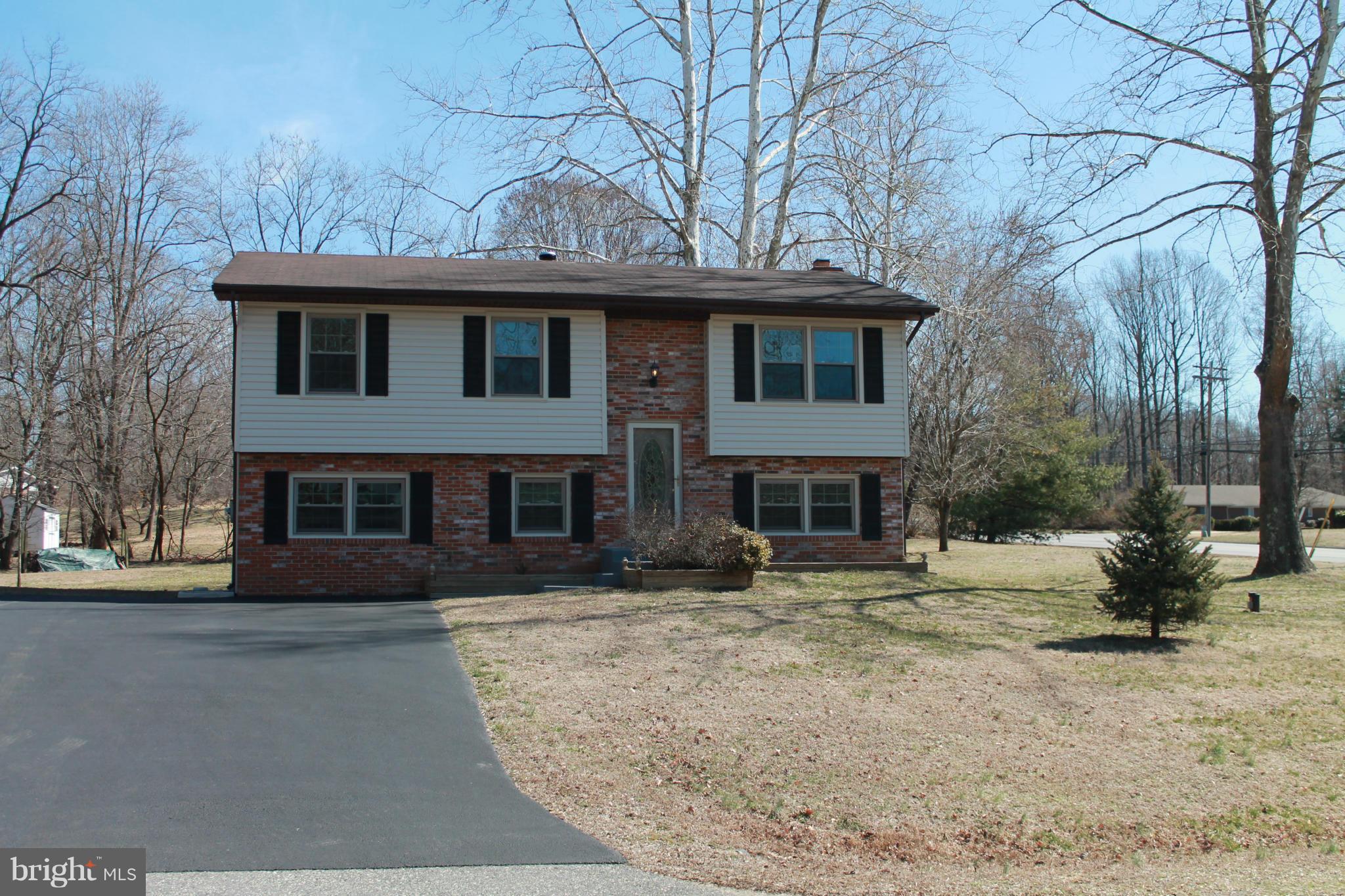 Meticulously cared for home!  Every room has fresh paint; new carpet throughout and new flooring in the kitchen, foyer & baths.  Driveway, siding, windows, storm doors, gutters & downspouts all new within the last 2 years.  Nothing to do but make this house your home!  Enjoy your large, flat, open, corner lot with mature trees & community deeded boat ramps, beach & playground. Home Warranty!