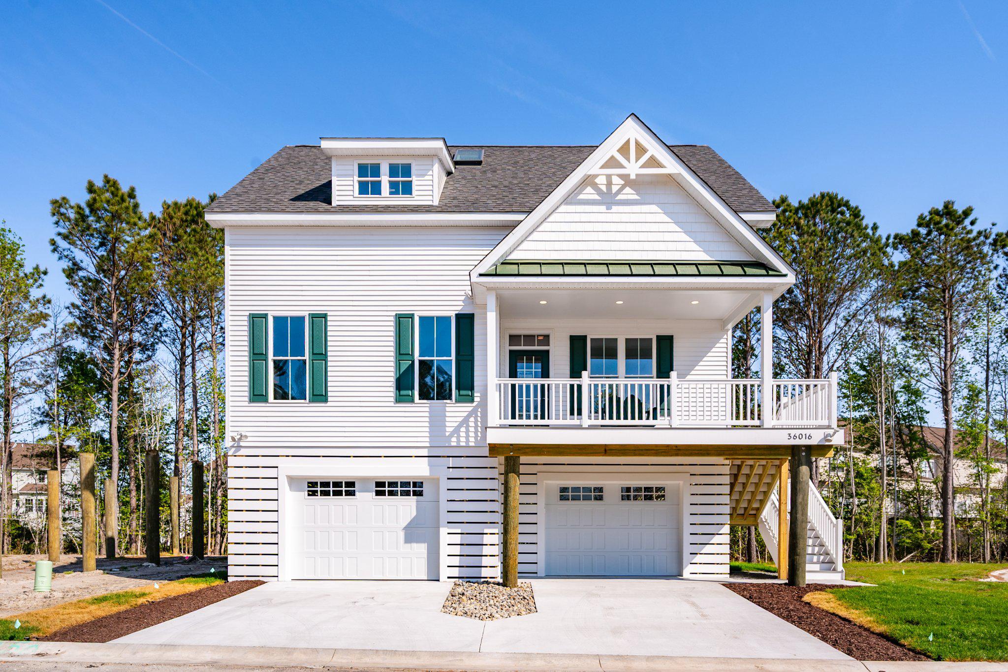 Only 16 families will call Seychelles their beach home and vacation getaway. Seychelles Bethany Beach might remind you of that old beach house you visited as a kid, but it’s a totally modern take on the style. Nestled on sturdy pilings with plenty of covered guest parking and a bunch of cool amenities like decks and porches, the Seychelles Bethany Beach homes are the perfect family getaway by the sea. This is the open-concept layout you remember, complete with a welcoming eat-in kitchen, a dining area for 10, and spacious bedrooms and bathrooms designed by a skilled and trustworthy Bethany Beach, DE home builder.

We have two awesome options for you to choose from. The Freeport I model has a 3-bedroom layout. The master bedroom is on the main level, and it has 2,175 square feet of living space.  The Freeport II model s a 4-bedroom layout, increasing the square footage to 2,306 and adds a 4th bedroom and an extra full bath to the home.  The 4-bedroom price is $699,000.  Both options have some really cool features, like luxury vinyl plank flooring on the first floor, bedrooms are carpet, ceramic tile in all bathrooms, and two more spacious bedrooms with walk-in closets on the second level. There’s even a full bath and laundry room there! The kitchen has stainless steel appliances, a 4 x 8 island with quartz countertops, and a spacious dining area.

This home also has a lot of extra space. It’s built on pilings that offer over 1,500 square feet of enclosed garage space, an outdoor shower and shed for storage, a screened porch on the rear deck, and a covered front porch for your morning coffee.

What are you waiting for?