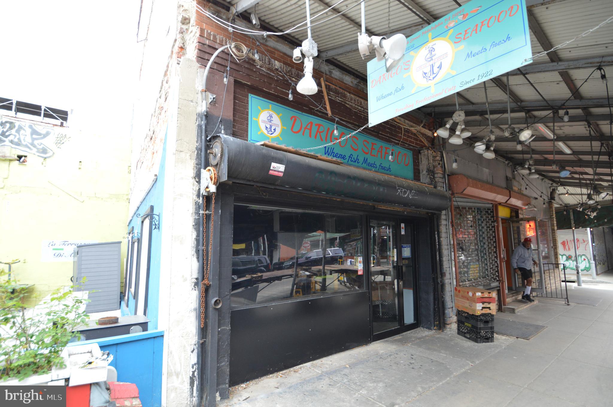 Rare opportunity on iconic 9th Street in Philadelphia’s historic Italian Market. Welcome to 1015 S 9th Street, the former longtime home of Darigo Seafood, now available for the next visionary owner to make their mark in one of Philadelphia’s most storied commercial corridors. Located in the heart of the Italian Market, this three-story CMX-2 zoned mixed-use property offers unmatched visibility, foot traffic, and historic charm.

The first-floor retail space features a traditional glass storefront secured by a roll-down padlocked gate and is in turnkey condition. Formerly used for seafood sales, it includes negotiable equipment such as ice machines, a walk-in refrigerator box, sorting tables, and other business fixtures, making it ideal for a new owner-operator or creative retail concept. The layout is open and flexible, perfect for capturing the energy and pedestrian activity of the market.

Access to the second and third floors is currently through a pull-down aluminum ladder, similar to accessing attic space. These upper levels were once a residential unit for the business owner but are now raw, undeveloped space in need of renovation. The CMX-2 zoning allows for a wide range of uses, including residential, office, or extended commercial space, giving the next owner flexibility and opportunity to reimagine the property.

The Italian Market is not only a Philadelphia institution but a national destination known as the oldest continuously operating outdoor market in the country. This stretch of 9th Street is alive with local vendors, longtime residents, tourists, and film history, famously featured in the Rocky series. The location benefits from constant foot traffic and a deep cultural identity that draws new businesses and customers alike.

Positioned within walking distance to Center City and close to neighborhoods like Bella Vista, Passyunk Square, Queen Village, and Washington Square West, the property is also well-connected by public transportation and major commuter routes. Whether you're an investor or an entrepreneur looking to plant your flag in one of the city’s most vibrant and visible locations, 1015 S 9th Street offers a rare chance to be part of a legacy location with future upside.