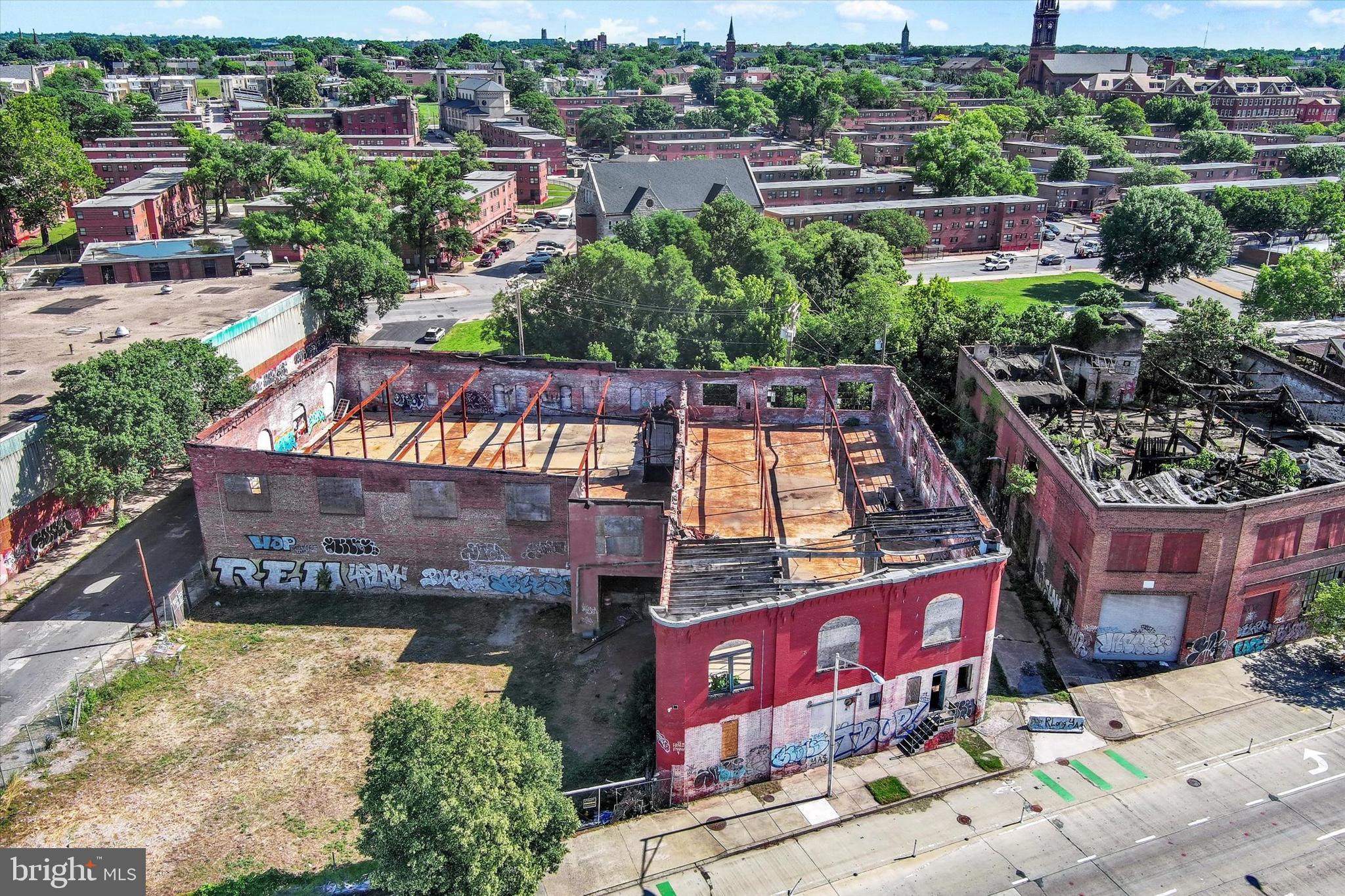 Exceptional redevelopment opportunity in the heart of Baltimore. 914 E Monument Street consists of approximately 33,222 square feet and is zoned IMU-1 (Industrial Mixed-Use 1), offering a wide range of potential uses and development possibilities.

Formerly home to the American Bearing Company Building, the property is currently condemned by the City of Baltimore and is being offered for its redevelopment value. The existing structure is in need of demolition, presenting a unique opportunity for investors, developers, and end users to reimagine the site and capitalize on the flexibility of the IMU-1 zoning designation.

Utilities are available on-site, providing a strong foundation for future development. Conveniently located with access to major transportation routes, employment centers, and surrounding commercial and industrial uses, this property offers significant potential for redevelopment in a growing urban market.

Buyers are encouraged to perform their own due diligence regarding zoning, permitted uses, demolition requirements, and future development plans. Property is being sold as-is.