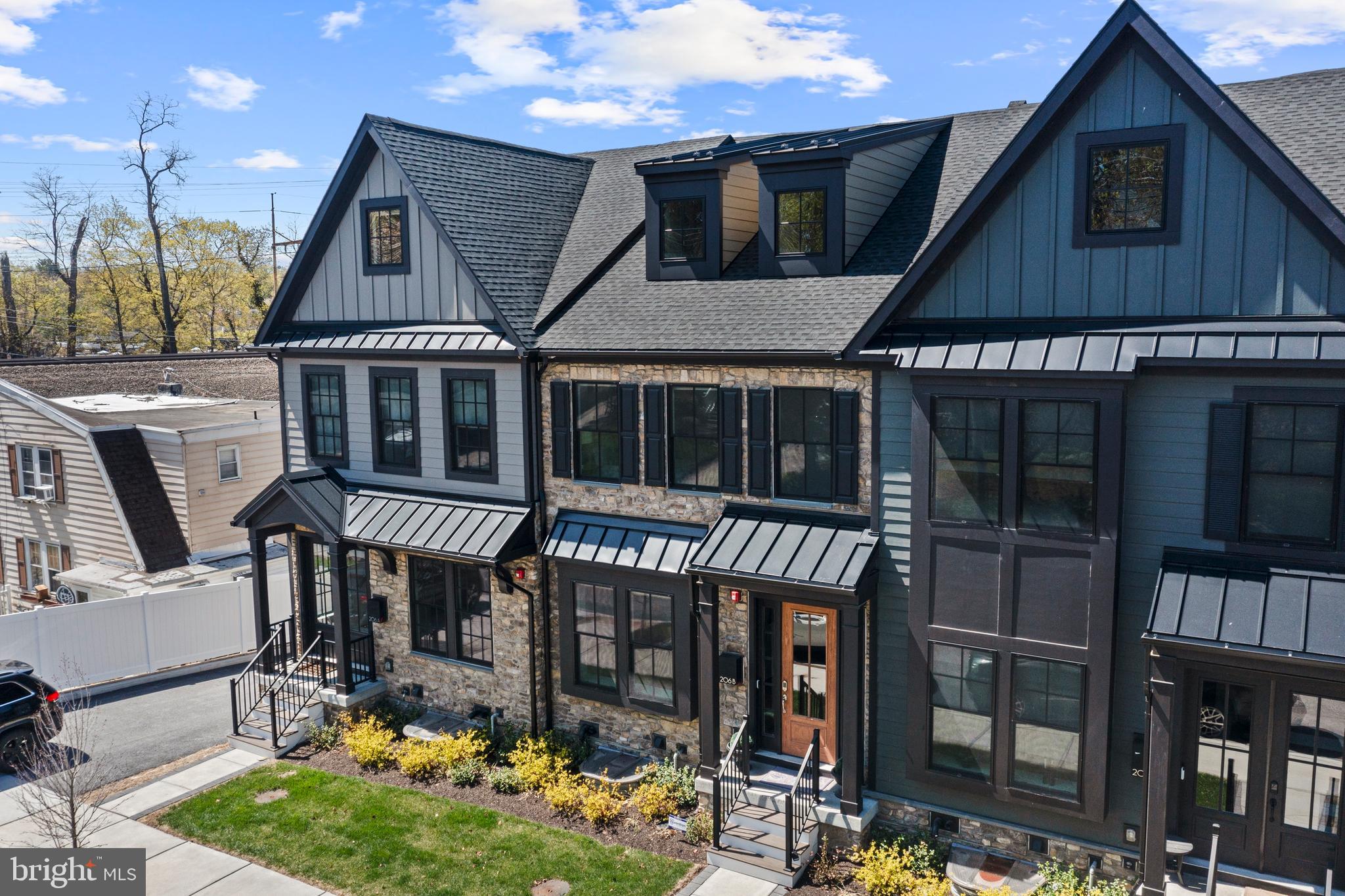 A rare opportunity to own a nearly new resale at Rockwell on Aberdeen, an exclusive 6-townhome luxury community in the heart of Wayne. Built in 2022 by Rockwell Homes, this townhome offers 3 bedrooms, 3 full and 2 half baths, and a sophisticated blend of modern design, high-end finishes, and smart home technology.
Spanning four spacious levels with an elevator (3 stops), this home offers 2,908 sq. ft. of beautifully crafted living space, including a finished lower level, a third-floor loft and attached garage. You will find exceptional design and high-end finishes inside and out.
The exterior features include James Hardie Cement Siding, Black Pella Windows- Lifestyle Series, a Composite Deck with Privacy Walls, and professional landscaping.
Enter the home through the covered front portico and wood framed door with glass panels. Gorgeous engineered 5” wood floors, 10” ceilings, coffered ceilings, large modern windows, soothing paint colors and stunning finishes welcome you. The sun-lit dining room features wainscotting and is open to the gourmet kitchen. The kitchen, in the center of the home, includes an extra-large 12’ island with seating for 6 outfitted with luxury white cambria quartz with veining, which is also used for the backsplash. Pendant lighting and custom two-toned 48” cabinetry -  white cabinets throughout except for black cabinetry found on the island - create much visual interest. The kitchen also includes a custom wood hood, high-end JennAir stainless steel appliances including a 30” double convection wall oven. This kitchen is the perfect space for everyday cooking as well as entertaining. Just beyond, a sophisticated great room awaits. It is centered around a floor-to-ceiling quartzite fireplace. The coffered ceiling emphasizes the 10’ height and provides warmth, style and elegance. This room provides access through black framed sliding doors to a private rear deck, ideal for morning coffee or evening relaxation. A powder room is conveniently located off of the great room.
The attractive staircase features modern oak rails with metal balusters and oak stairs with white painted risers. Engineered hardwood floors continue on the upper level. The luxurious primary suite features a tray ceiling and ceiling fan and two walk-in closets outfitted with designer shelving systems. A spa-like bath offers dual vanities, Moen chrome centerset faucets, quartz countertops, a private water closet, and a large walk-in frameless chrome shower door with built-in niches and dual showerheads. Also found on this level are a second en-suite bedroom, and the conveniently located laundry area. Continuing upstairs to the generous sized third-floor loft with a full bath (3). This level provides versatility as bedroom 3, a guestroom, a home office, or a bonus space.
The flexible Lower Level also offers engineered hardwood flooring, recessed lighting, as well as a window egress. It is the perfect space for a home office, gym, or second lounge area, complete with a powder room, the second in the home. It also provides direct access to the rear-entry two-car garage.
Situated just 0.5 miles from the Wayne Train Station, with direct service to Philadelphia and NYC, and located in the top-ranked Radnor Township School District, Rockwell on Aberdeen delivers both unmatched convenience and low-maintenance luxury living. This home offers walkability to Wayne’s many restaurants, including Rosalie, 118 North, Christopher’s, The Goat’s Beard, and more. Nearby shopping includes the many shops in Wayne such as Best Hardware and Boyds. Just beyond Wayne you will find Terrain and Whole Foods Market in Devon, Estia Taverna in Radnor, Eagle Village Shops and restaurants, Strafford Farmers Market, DiBruno Bros, The Radnor Trail, Chanticleer Garden, Wayne Art Center, and King of Prussia Mall and so much more.
Don’t miss your chance to own this nearly new resale!