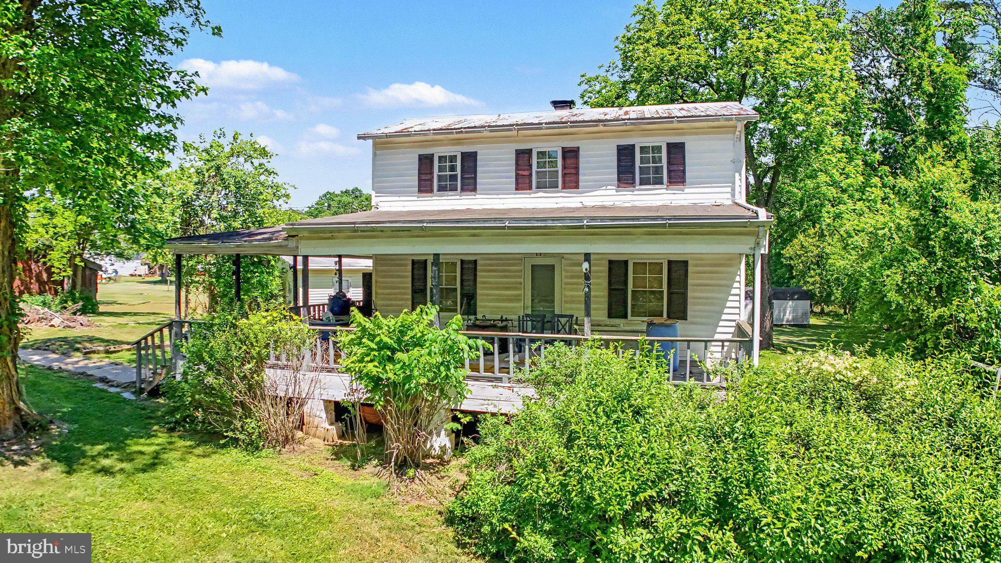 Welcome to this 9 +/- acre subdividable property that is surrounded by mother nature at its finest. Property consists of an old barn, shed, and three homes.  The Main house consists of three bedrooms, three baths, and a full basement set up and nearly ready for separate living with a bedroom, bathroom, kitchen, and walkout entrance.  The guest house/tenant house offers two bedrooms and one bathroom.  The roof leaked and needs some TLC.  The two bedroom and two bathroom mobile home has been well cared for and is ready to move in.  Live here while the Farm House and two bedroom house are being restored to your liking. There are many possibilities with three additional lots waiting for someone to come in with a visual.  According to the Seller this property goes back to the civil war.  Additionally, the Girl Scouts retreat to over 450 acres to the North, East, and South, offering peace and tranquility.  The property is being sold as-is and the seller will not perform any repairs.  According to the Seller, the original 1900 home had burned down.  The main farm house was built in 1968.  All agents and buyers must confirm with the county regarding any zoning, building requirements, and subdivision requirements.  Listing Agent and Broker are not responsible for any zoning, tax, lot size, or any other information provided by the county.