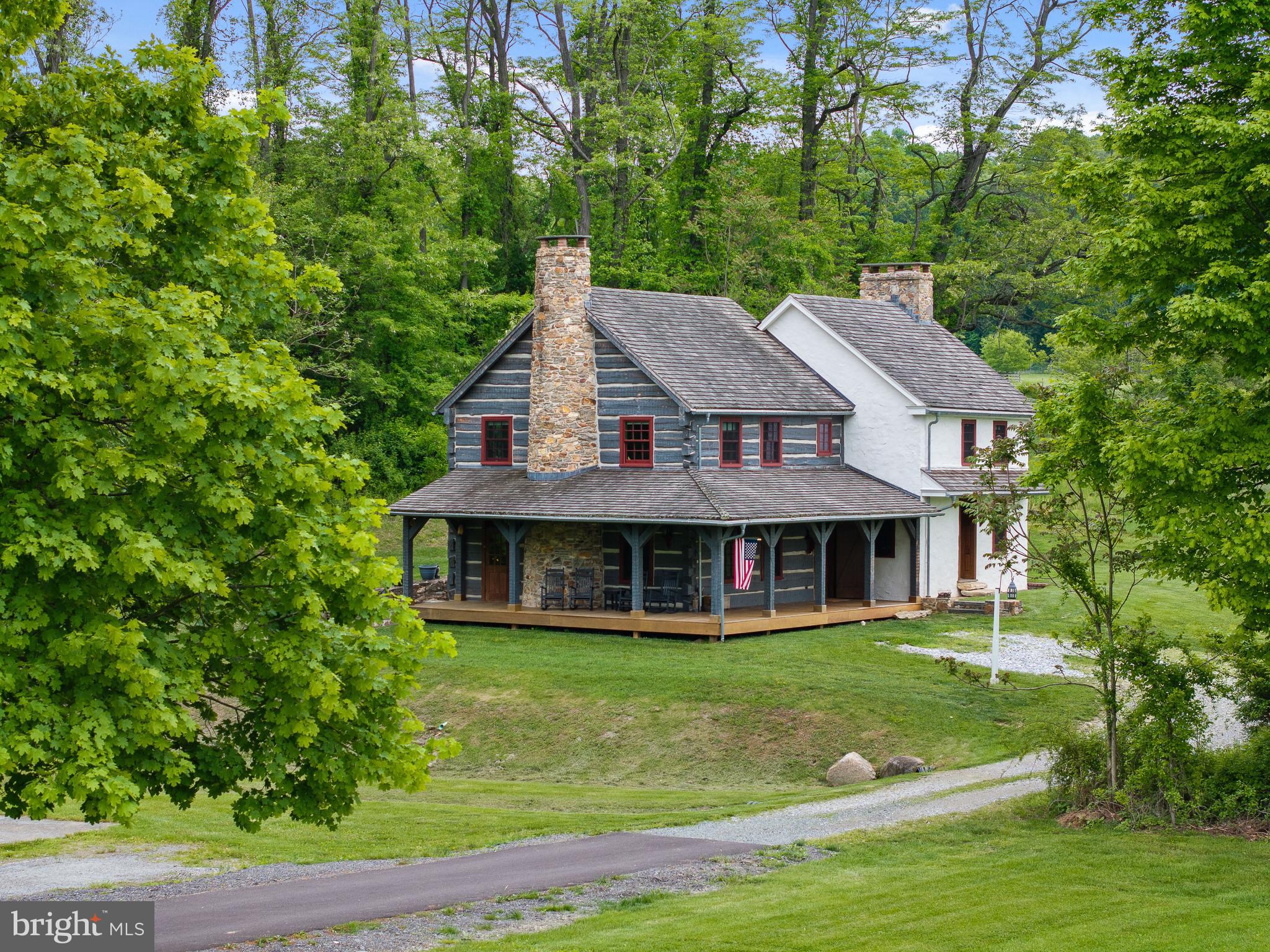 NEW PRICE! Welcome to 150 Springdell Road, a truly exceptional opportunity to own over 40 acres of pristine countryside in West Marlborough Township, Unionville, PA—one of Chester County’s most sought-after and scenic locations. Tucked away in a peaceful valley and surrounded by hundreds of conserved acres protected by the Brandywine Conservancy, this non-deed restricted property offers unparalleled privacy and the freedom to create your dream estate. Whether you're an equestrian enthusiast or simply seeking a serene rural lifestyle, this property delivers. At its heart is a charming 2-bedroom historic stone farmhouse, believed to date back to 1638, seamlessly blended with a rustic log cabin addition and a wraparound porch added in 2014.  Known as Summer Duck Lane, the home is rich in character and history, offering panoramic views of rolling hills and lush pastures. Set in a bucolic setting with a long-paved drive leading to a secluded homesite complete with a Stone springhouse, tranquil pond and sweeping vistas. Former Pomeroy and Newark Railroad bed was converted into a private walking trail with a restored footbridge. The property is Two separate tax parcels offering flexibility for expansion or development and is in Act 319 for favorable tax benefits. Located in the prestigious Unionville-Chadds Ford School District and within Cheshire Hunt Country, ideal for equestrian pursuits. Minutes from The Whip Tavern, Brandywine River Museum, Longwood Gardens and historic Chadds Ford. Easy access to Philadelphia, Wilmington, Baltimore, D.C., and NYC! Whether you envision expanding the existing residence, building a new home, or creating a world-class equestrian facility, 150 Springdell Road offers endless possibilities in a setting of unmatched natural beauty!