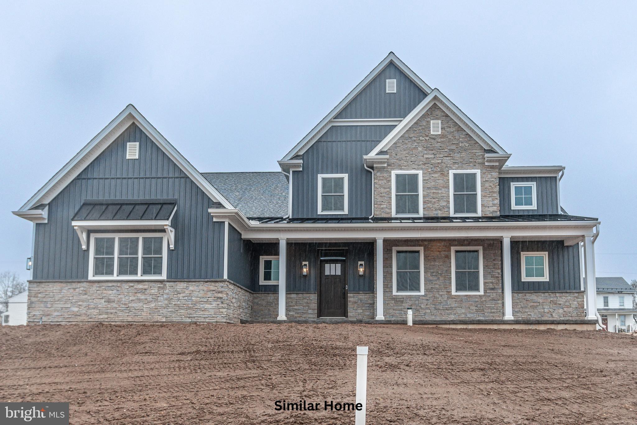 Discover the opportunity to build the stunning Garrison plan on a spacious half-acre-plus homesite in the prestigious Addington Reserve community, located within the highly sought-after Central York School District. This thoughtfully designed two-story home with a first-floor owner’s suite offers 3,136 square feet of beautifully crafted living space, including 4 bedrooms, 3.5 baths, and a generously sized 2-car side-load garage with an additional storage bay. Construction will be expertly managed by Phil Carpenter Custom Homes, one of the region’s premier custom builders known for quality craftsmanship and attention to detail.

The main level features a private owner’s retreat designed for comfort and relaxation, complete with a luxurious spa-inspired ensuite that includes a soaking tub, an expansive walk-in shower, and direct access to a large walk-in closet for exceptional convenience. The heart of the home is a chef’s kitchen outfitted with a grand center island, granite countertops, and a walk-in pantry, all flowing seamlessly into the open dining area and great room—perfect for both entertaining and everyday living. A versatile flex room on the first floor provides the ideal space for a home office, den, or hobby area.

Upstairs, you’ll find two bedrooms connected by a Jack and Jill bathroom with dual sink vanity, a spacious loft adaptable to your lifestyle needs, a conveniently located laundry room, and a fourth bedroom with access to its own nearby full bath. An optional main-floor laundry room is available for added ease and functionality.

Elegant high-end finishes enhance the home’s curb appeal, including striking stone masonry, stylish board-and-batten accents, and a welcoming full-length front porch. Buyers are encouraged to inquire about available incentives when using the builder’s preferred lender and title company. Additional home plans are also available to suit a variety of preferences.