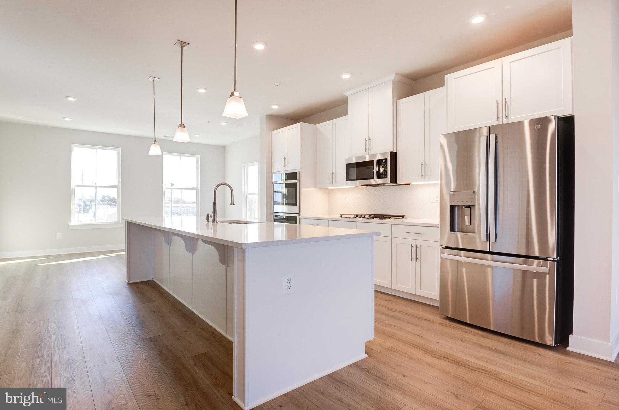 Brand new, first time on rent at Lomond Village Sub-division, in Prince William County! This Sub-division is situated near shopping, dining, major commuter routes, & recreation! The community will feature a tot lot, village green, & bike rack soon | Mowing & lawncare included | END, upper 2 levels (third & fourth), stacked, townhome style CONDO. Interior finished 2481 sq ft equipped w/3 bedrms, 2 full baths, & 1 half bath; covered sky lanai & 1 rear car garage w/opener. Ample guest parking spaces available at the sub-division streets <br> <br> Ryan Homes built, Picasso floorplan, an open floorplan that allows light to flow through the entire area, an appealing modern design where comfort & convenience merge seamlessly; designed to be both practical & stylish. The first floor features chef's dream kitchen w/a huge work island & pantry, formal dining, & an amazing sky lanai w/fireplace off of the great room bringing the outdoors in. Upper bedrm level is a truly magnificent owner's suite featuring dual walk-in closets, sitting area, & a bath w/an oversized shower, dual vanities, & a water closet. Two generous secondary bedrms that share a hall bath w/dual bowl vanity, a linen closet, & a laundry complete the bedrm level <br> <br> Excellence in style, function & location. Direct access to Rte. 234, under 2 miles to I-66, walking distance to Westgate Plaza Shopping Center, just a half a mile to Costco & Bull Run Plaza, a mile away to Manassas Mall, 3 miles to Old Town Manassas shops, restaurants, & VRE station, less than 15 minutes to Centreville & Gainesville's Virginia Gateway shops & restaurants