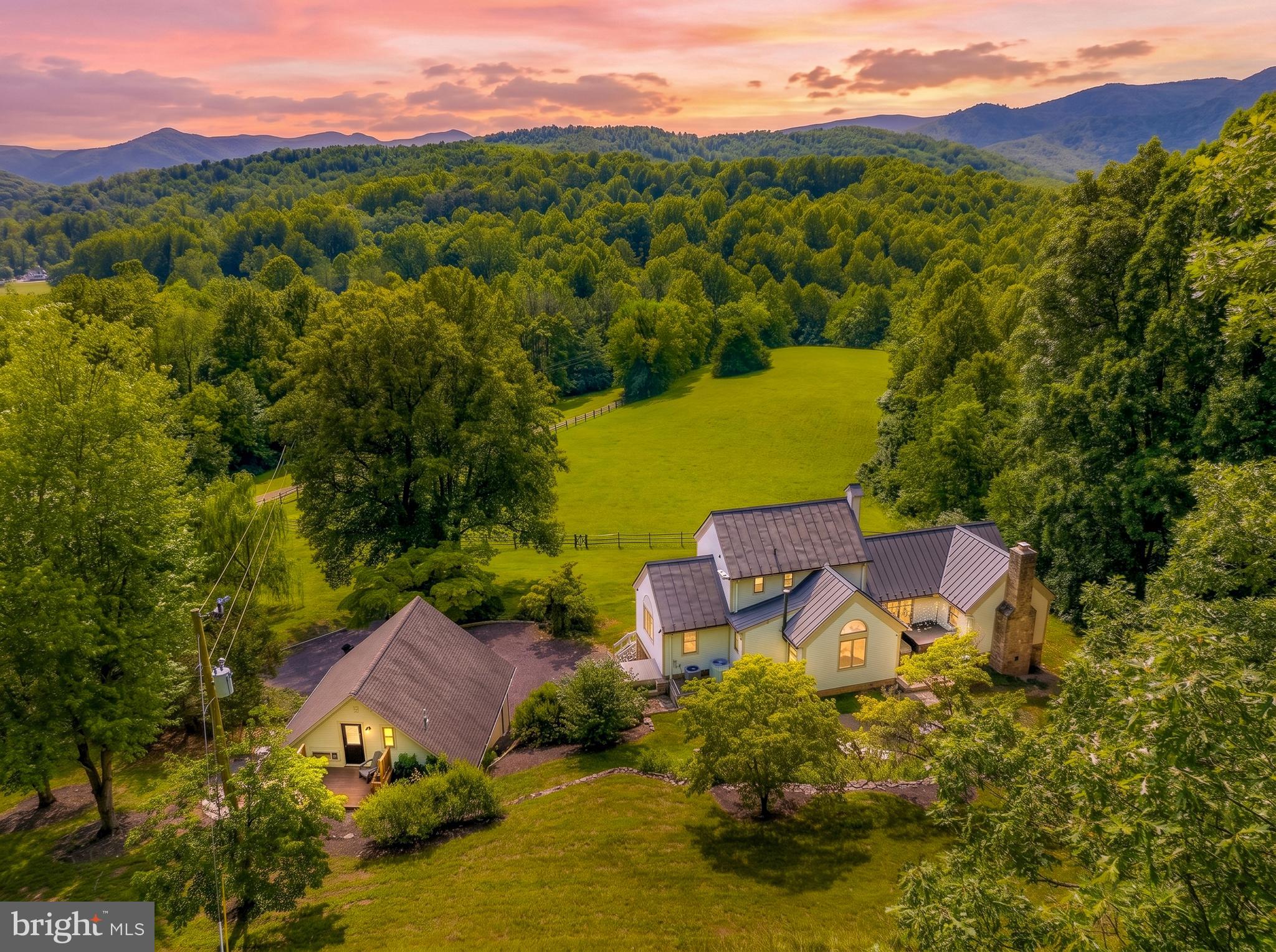 Welcome to Spring Hill – A Shenandoah Valley Retreat Like No Other

There are properties you visit, and there are places that stay with you forever. Spring Hill is one of those rare places. Unique 5 BRs, 5 Baths, 3,564 finished square feet Spring Hill — where the mountains greet you each morning and the Virginia countryside unfolds at your doorstep. 

Don't forget to check Virtual Tours.

Tucked away on more than 26 acres of rolling countryside in the heart of Virginia's breathtaking Shenandoah Valley, Spring Hill is where nature, craftsmanship, and tranquility come together in perfect harmony. Every morning begins with spectacular views of Old Rag Mountain rising in the distance, while the gentle sounds of a seasonal stream and rustling woodland create a peaceful backdrop that feels worlds away from the pace of everyday life.

Inspired by the timeless elegance of an early Virginia farmhouse, this custom-built timber-frame home was designed to embrace both its surroundings and the people who gather here. Spanning over 3,500 finished square feet across three levels, the residence offers five bedrooms and five full baths, creating an inviting balance of spaciousness and comfort. Soaring cathedral ceilings fill the home with natural light, while multiple private suites provide welcoming retreats for family and guests alike.

What truly makes Spring Hill special is its deep connection to the land itself. The home's impressive stone foundation and chimney were crafted from stones gathered directly from the property, creating a lasting bond between the house and the landscape that surrounds it. Every detail reflects a sense of authenticity, character, and care.

Outside, the possibilities are endless. Open pastures, mature woodlands, and a four-stall stable make the property ideal for horse lovers, hobby farmers, outdoor enthusiasts, or anyone seeking room to roam. A professionally landscaped setting, relaxing hot tub beneath the stars, and expansive outdoor spaces invite you to slow down and enjoy the simple pleasures of country living.

Beyond being a remarkable residence, Spring Hill offers exceptional versatility. A detached two-car garage includes a beautifully finished apartment that currently operates as a successful short-term rental, providing immediate income potential. Whether you continue the rental program, create a guest retreat for visiting family and friends, or establish a private office or studio, the choice is yours.

Adventure begins just beyond the property gates. Hike the iconic trails of Old Rag Mountain, explore the waterfalls of White Oak Canyon, or spend the day discovering the scenic beauty of Shenandoah National Park and Skyline Drive. Cast a line in the renowned Rapidan and Rose Rivers, visit President Herbert Hoover's historic Rapidan Camp, or enjoy horseback riding through the surrounding countryside.

The region is equally celebrated for its wineries, breweries, charming villages, and vibrant local culture. Spend afternoons tasting award-winning wines, browsing art galleries in historic towns such as Sperryville and Washington, Virginia, or simply enjoying the slower pace that makes this corner of the Shenandoah Valley so beloved.

Whether you envision a private mountain estate, an equestrian retreat, a weekend escape from city life, or a property that combines luxury living with proven rental income, Spring Hill offers a rare opportunity to experience the very best of Virginia country living.

This is more than a home.

It is a place to gather, explore, invest, and create lasting memories for generations to come.

Welcome to Spring Hill.

$25k for furniture and personal property.