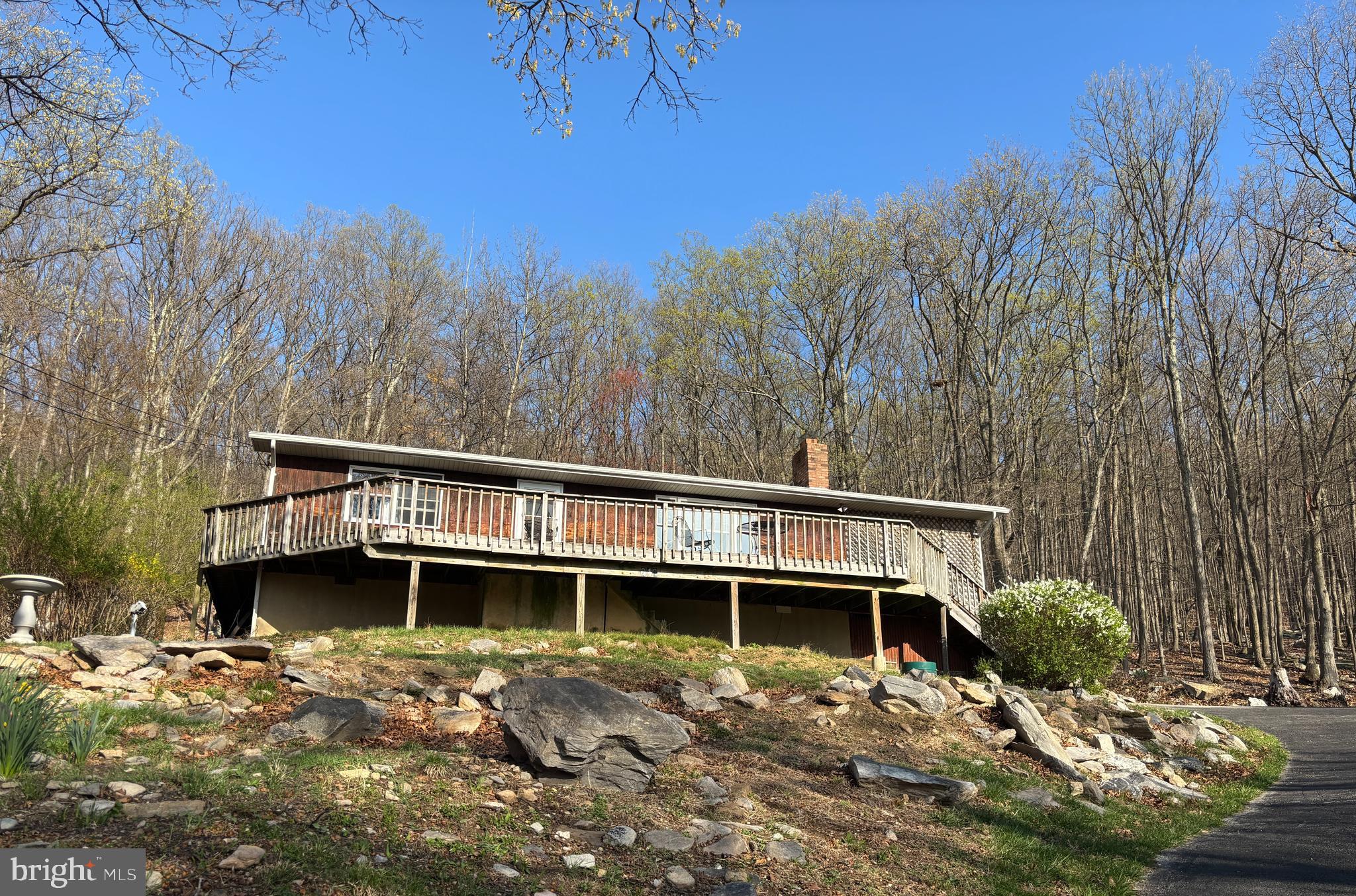 Welcome to 212 Skyline Trail—an incredible opportunity nestled in the scenic hills of Harpers Ferry. This two-bedroom, one-bath rancher sits on over three acres, spread across five separate parcels—four of which are contiguous, and the fifth located directly across the street. That parcel could be partially cleared to enhance your seasonal mountain views.

The property backs to the Appalachian Trail, offering direct access to one of the most iconic hiking routes in the country—ideal for nature lovers and outdoor enthusiasts. The state-maintained roads ensure reliable year-round access, and high-speed Comcast internet delivers blazing-fast service with up to 1200 Mbps, perfect for remote work or streaming.

While the home has not been recently updated, it offers fantastic potential to renovate and customize. The surrounding land provides space, privacy, and possible subdivision potential, making this a versatile investment opportunity.

Whether you’re looking for a peaceful full-time residence, a weekend retreat, or a property with future development options, 212 Skyline Trail is a rare find in a truly beautiful setting.

Schedule your showing today and explore the possibilities!
*Professional photos will be uploaded before property goes Active