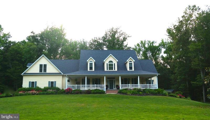 WOW! Check MRIs documents for all the features, to much to list . Beautiful 4/5 bedrooms, 4.5 baths,3 car garage,5 acres,full basement with awsome workshop area. 9'ceilings,stone fireplace floor to ceiling,2 masterbedroom suites,one of them on the main level. Screened porch,deck,library with built -ins,recessed lighting,tons of storage, walk in closets throughout.  Very nice home!!