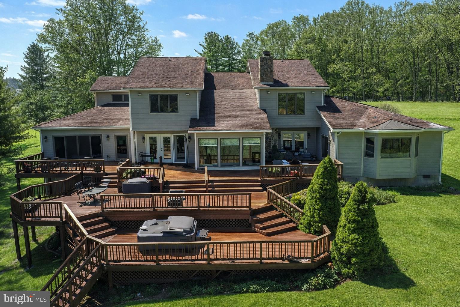 Experience lakefront living at its finest in this exceptional 5-bedroom, 3.5-bath home offering over 4,600 square feet of living space on a private lot of more than one acre. Featuring an incredibly spacious primary suite on the main level, as well as an additional master suite on the second level, this home is ideal for both full-time living and hosting guests. Enjoy breathtaking lake views from nearly every angle, anchored by a stunning native stone fireplace and a spacious, well-appointed gourmet kitchen, perfect for entertaining. Outdoor living is unmatched with a three-tiered deck system with incredible views of the lake, outdoor fireplace, and a private walkway leading to approximately 125 feet of pristine lake frontage. A 2-car attached garage and an additional 3-car detached garage with an 18'X32" storage area on the second level provide ample space for vehicles, boats, and storage. With well and septic, propane forced-air heating with heat pump, and central A/C, this property offers comfort and efficiency year-round. Whether you’re seeking a primary residence, luxury vacation retreat, or rental/investment opportunity, this lakefront estate delivers the ultimate waterfront lifestyle. RAILEY REALTY IS NOT THE CARETAKER OF PROPERTIES LISTED BY IT. DURING INCLEMENT WEATHER CONDITIONS, PROSPECTIVE PURCHASERS AND THEIR AGENTS ASSUME ALL LIABILITY ASSOCIATED WITH OR BY WEATHER AT THE PROPERTY.