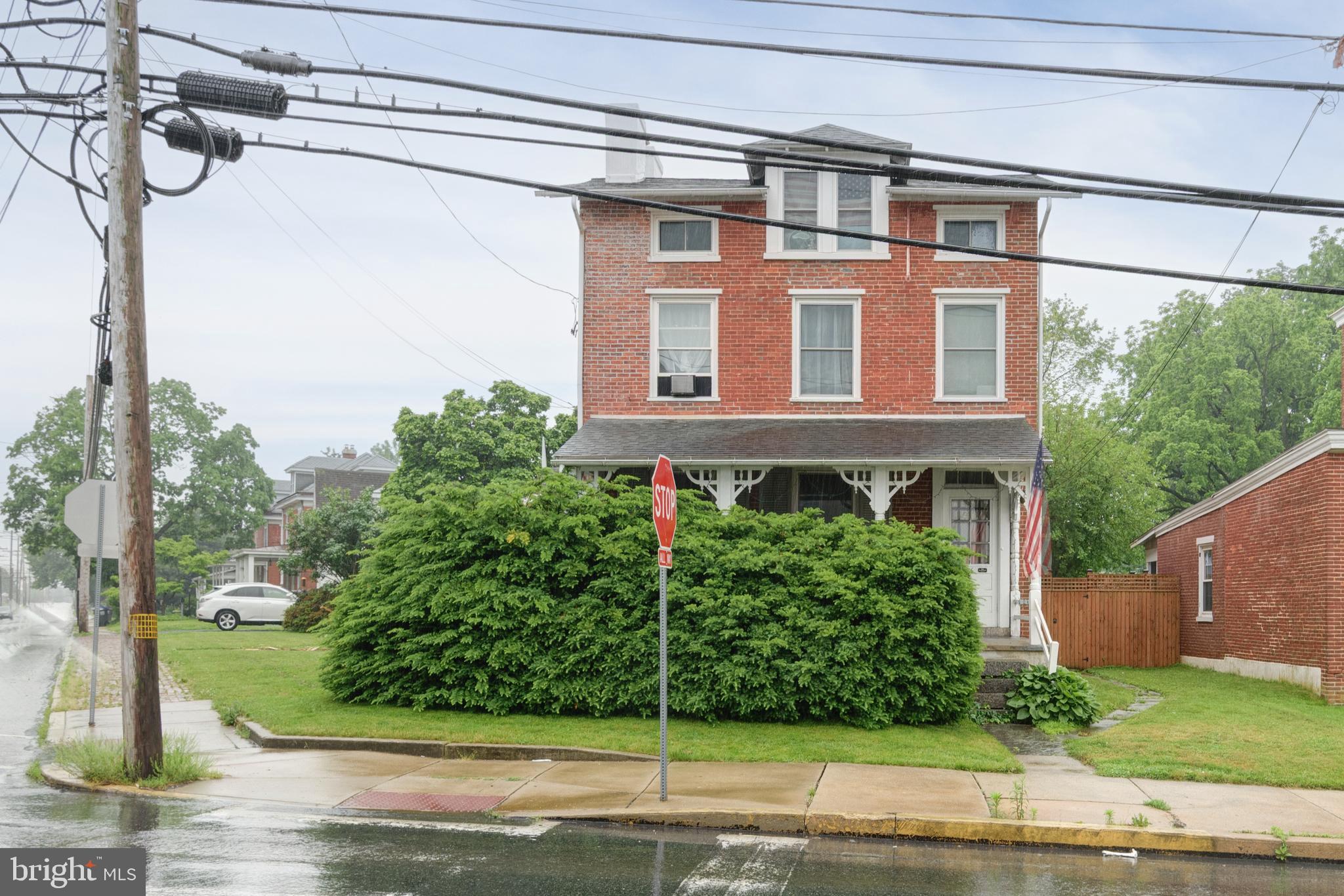 Step into the charm and character of this classic 19th-century two story, two-unit brick home ideally situated in the heart of the Oxford Borough, just a short walk to downtown shops, restaurants, and everyday amenities. This all-brick corner property offers timeless appeal with sunny exposures, beautiful wood floors and more. Each unit has 2 bedrooms and one full bath with many updates made over the past years. A rare opportunity for owner-occupants and investors alike. Live comfortably in one unit while the second unit helps offset your mortgage with rental income. The property also features a spacious three-bay garage, adding valuable storage, workshop space, or off-street parking options. Whether you're looking to begin your homeownership journey or expand your investment portfolio, this unique multi-unit property offers flexibility, charm, and endless potential in a convenient borough location.