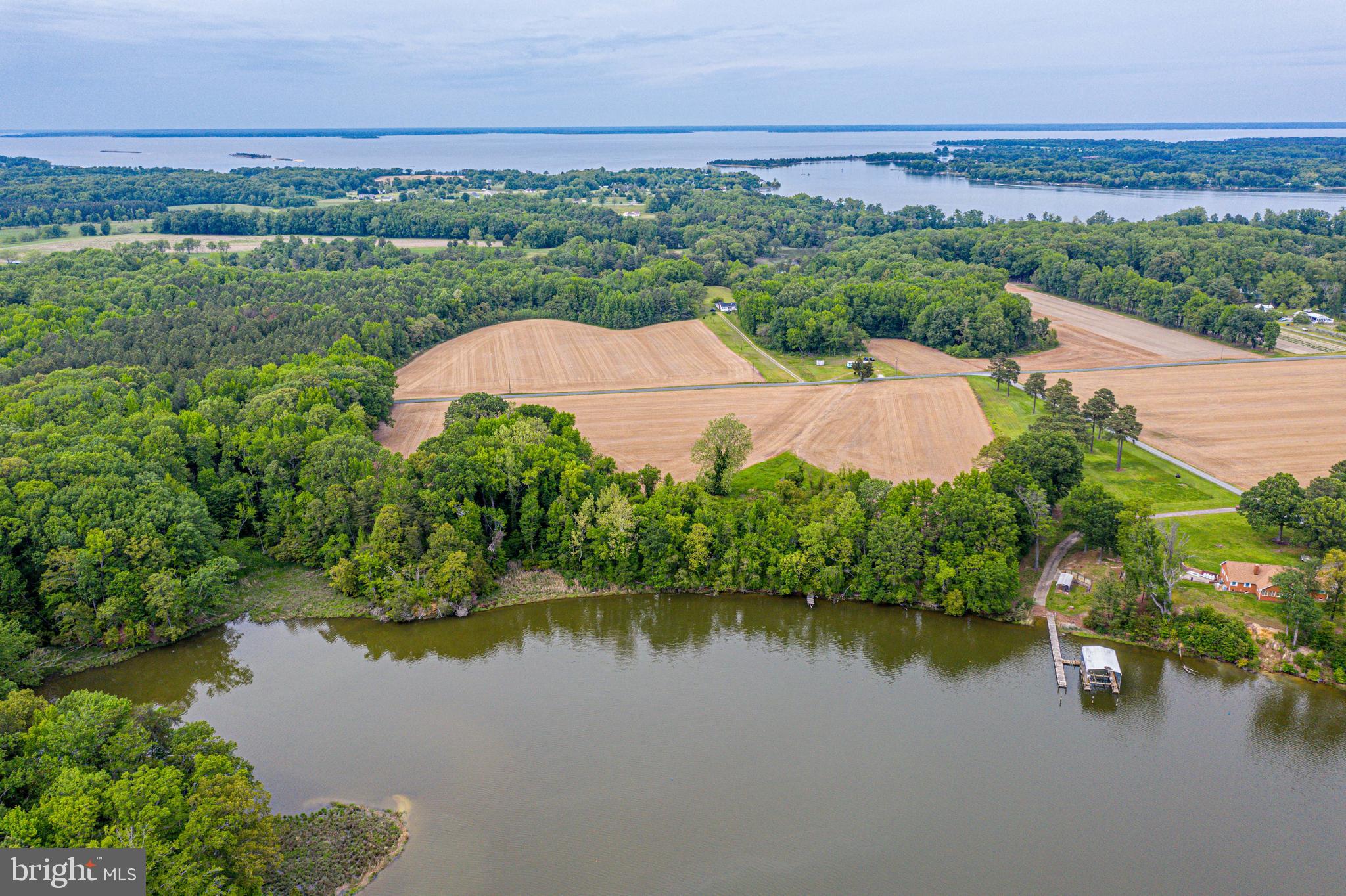 Welcome to lot 5 Zacata Rd.! This Shovel-Ready Waterfront Estate on Zacata Rd has Approved 120’ Pier Plans, Incredible Views & Rare 4-Bedroom Conventional Perc! Escape to the breathtaking natural beauty of Virginia's historic Northern Neck. Lot 5 on Zacata Road (Tax Map 36-45 Remainder) offers a rare opportunity to build your ultimate waterfront dream home on a gorgeous, sprawling 3.019-acre estate. Perched perfectly along the serene waters of Jenkins Cove where it flows directly into Nomini Creek, this property boasts unmatched, panoramic water views. Enjoy front-row seats to spectacular sunrises, pristine wooded shorelines, and vibrant coastal wildlife. The natural marsh frontage acts as a permanent privacy buffer, ensuring your unobstructed views remain completely undisturbed forever. The ultimate water access thanks to fully completed, custom plans included with the sale. You can step right past the shoreline via a meticulously planned private pier. All regulatory heavy lifting has been bypassed: The Virginia Marine Resources Commission has granted statutory authorization (VMRC #2025-1486) for a spectacular 120-foot-long private pier. The Westmoreland County Wetlands Board has officially determined that no additional wetlands permit is required to construct this open-pile structure. The approved plans feature a 100' x 5' walkway culminating in an expansive 20' x 20' (400 sq. ft.) "EL" platform, complete with 4 additional mooring poles engineered for a future boat lift extending 85 feet channelward. Deepwater access is completely unlocked. The site sketch is done, the boundaries are surveyed and the permits are secured. Skip the year of bureaucratic red tape and engineering costs. Bring your builder, choose your house plans, and start building your waterfront legacy today.