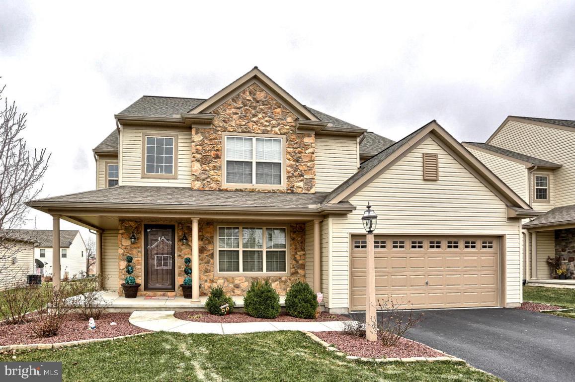 Beautiful Colonial EG Stoltzfus home meticulously decorated and manicured landscaping in highly desirable community Hempfield Crossings.   Spacious family room adjoins an oversized eat-in Gourmet Kitchen. Highly functional kitchen with stainless steel appliances will appeal to the cook in your family.  Upgraded hardwood flooring with a  2 car garage which adjoins a sizable mudroom/washer and dryer. Deck off of the kitchen. Plus more space in a